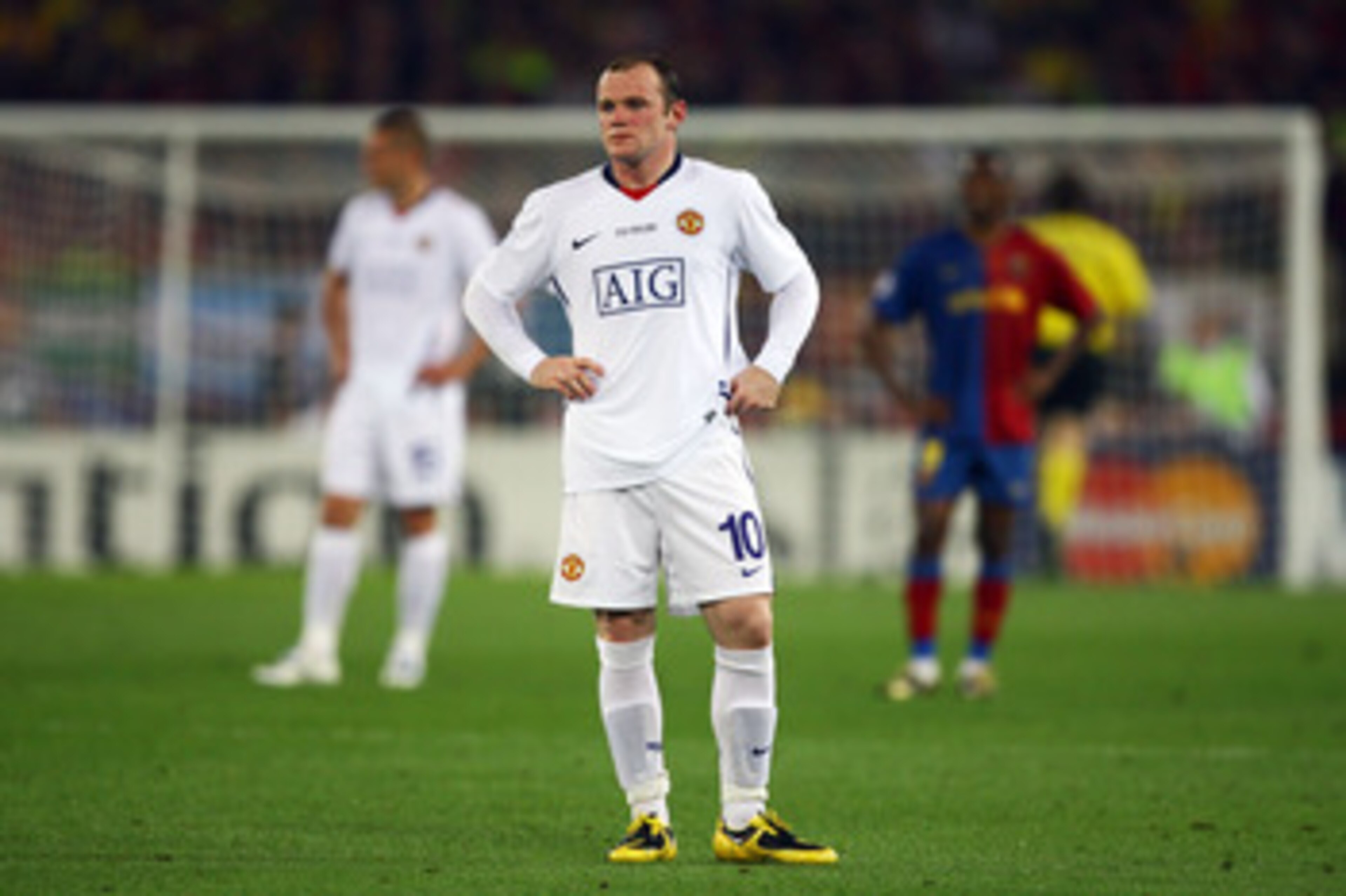 ROME - MAY 27:  Wayne Rooney of Manchester United looks dejected after Lionel Messi of Barcelona scored the second goal for Barcelona during the UEFA Champions League Final match between Barcelona and Manchester United at the Stadio Olimpico on May 27, 20