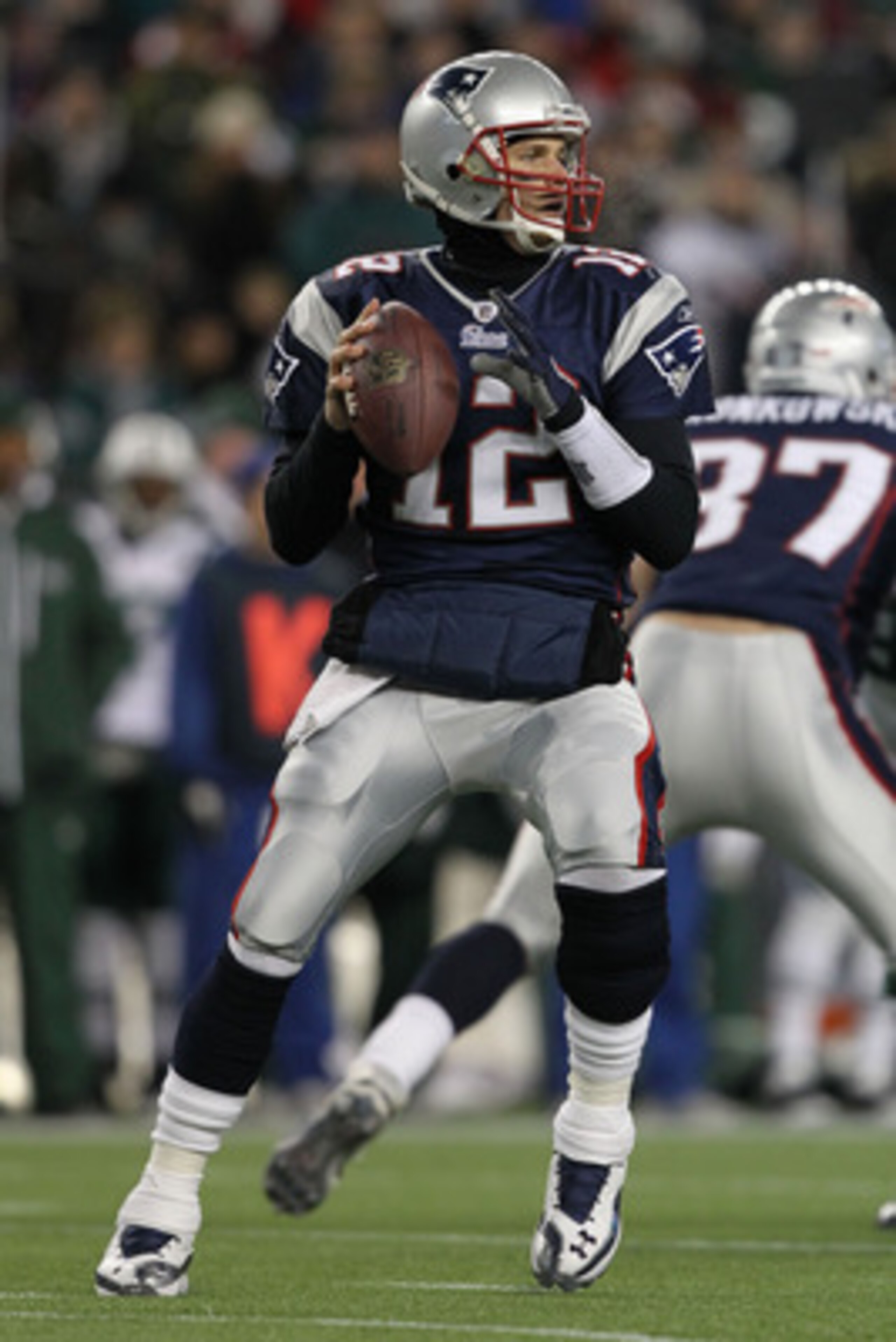 FOXBORO, MA - JANUARY 16:  Quarterback Tom Brady #12 of the New England Patriots looks to pass during their 2011 AFC divisional playoff game against the New York Jets at Gillette Stadium on January 16, 2011 in Foxboro, Massachusetts.  (Photo by Al Bello/G