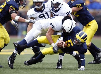 ANN ARBOR, MI - OCTOBER 24:  Tate Forcier #5 of the Michigan Wolverines gets taken down for a sack by Josh Hull #43 of the Penn State Nittany Lions on October 24, 2009 at Michigan Stadium in Ann Arbor, Michigan.  (Photo by Gregory Shamus/Getty Images)