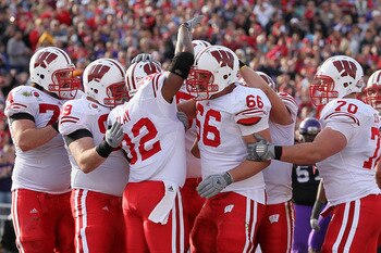 PASADENA, CA - JANUARY 01:  Running back John Clay #32 of the Wisconsin Badgers celebrates with teammates after scoring a touchdown in the first quarter against the TCU Horned Frogs during the 97th Rose Bowl game on January 1, 2011 in Pasadena, California
