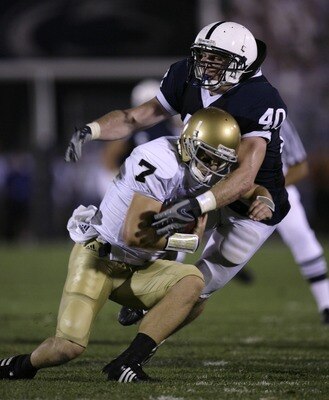 STATE COLLEGE, PA - SEPTEMBER 8: Quarterback Jimmy Clausen #7 of Notre Dame is sacked by linebacker Dan Connor #40 of Penn State during the second half of the game between University of Notre Dame Fighting Irish and Penn State Nittany Lions September 8, 2