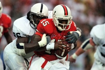 18 Sep 1999: Quarterback Kenny Kelly #15 of the Miami Hurricanes is sacked by Courtney Brown #86 of the Penn State Nittany Lions at the Orange Bowl in Miami, Florida. The Nittany Lions defeated the Hurricanes 27-23.