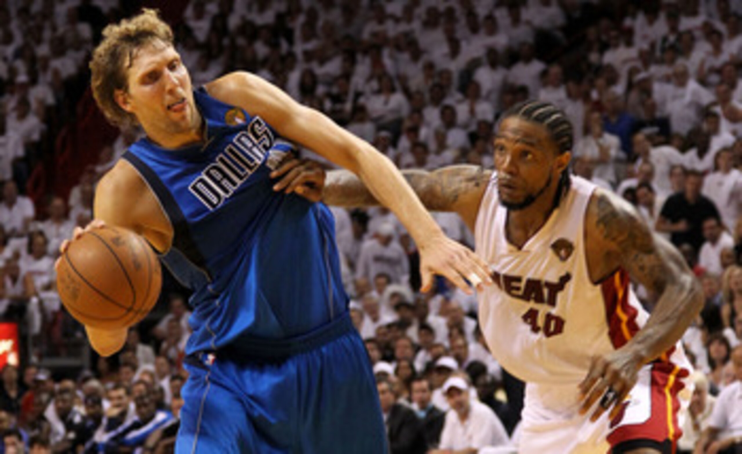 MIAMI, FL - MAY 31:  Dirk Nowitzki #41 of the Dallas Mavericks drives on Udonis Haslem #40 of the Miami Heat in the fourth quarter in Game One of the 2011 NBA Finals at American Airlines Arena on May 31, 2011 in Miami, Florida. NOTE TO USER: User expressl