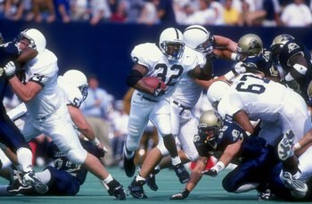 19 Sep 1998   Tail back Cordell Mitchell #32 of the  Penn St. Nittany Lions tucks the ball as he runs up field during the game against the Pittsburgh Panthers at Pittsburgh Stadium in Pittsburgh,  Pennsylvania. Penn St. defeated Pittsburgh 20-13. Mandator