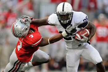 COLUMBUS, OH - NOVEMBER 13:  Silas Redd #25 of the Penn State Nittany Lions stiff arms Jermale Hines #7 of the Ohio State Buckeyes  at Ohio Stadium on November 13, 2010 in Columbus, Ohio.  (Photo by Jamie Sabau/Getty Images)