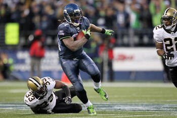 SEATTLE, WA - JANUARY 08:  Marshawn Lynch #24 of the Seattle Seahawks runs down field against Jabari Greer #33 of the New Orleans Saints during the 2011 NFC wild-card playoff game at Qwest Field on January 8, 2011 in Seattle, Washington.  (Photo by Otto G