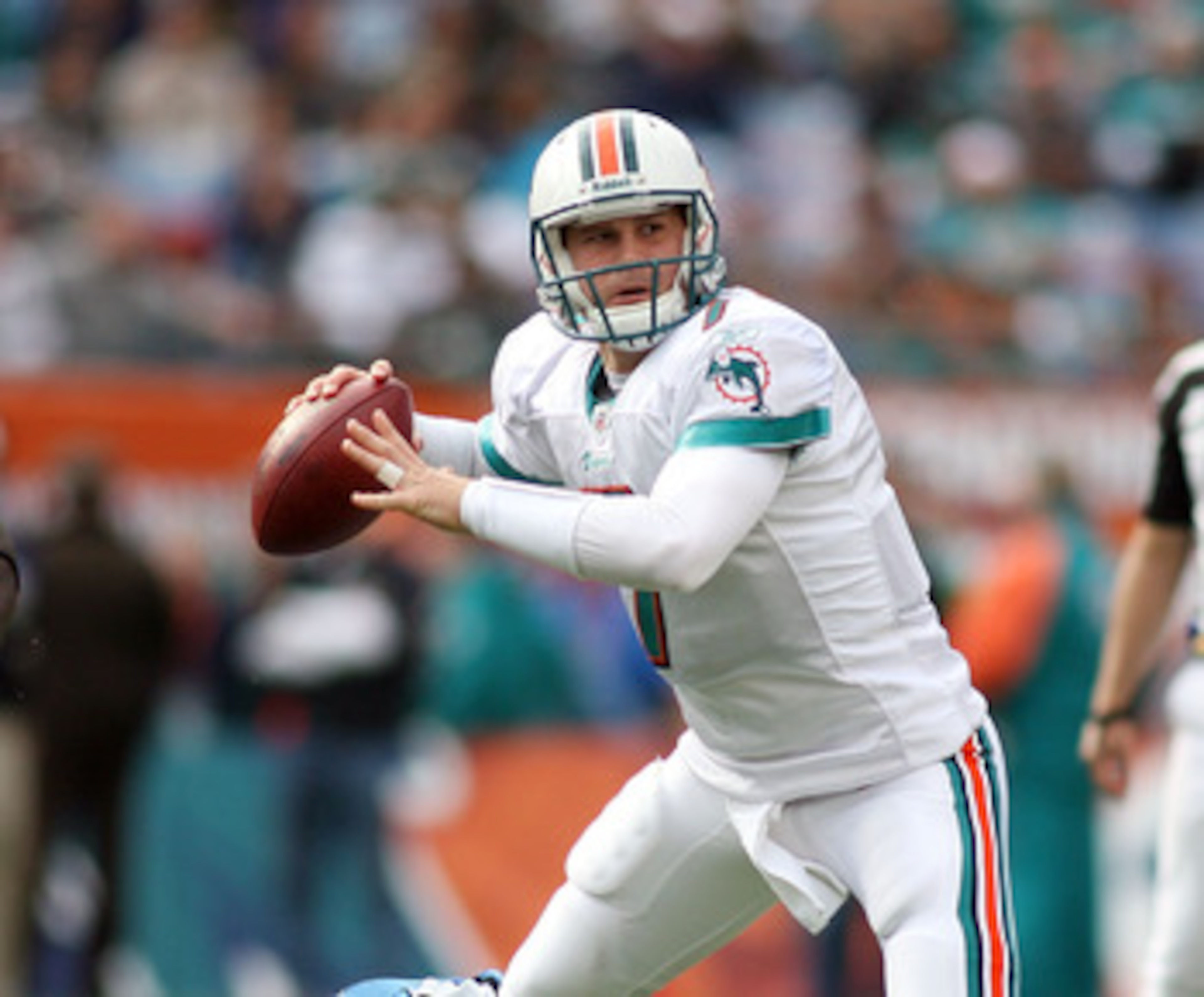 MIAMI - DECEMBER 26:  Quarterback Chad Henne #7 of the Miami Dolphins is preasured by Lawrence Jackson #94 of the Detroit Lions at Sun Life Stadium on December 26, 2010 in Miami, Florida.  (Photo by Marc Serota/Getty Images)