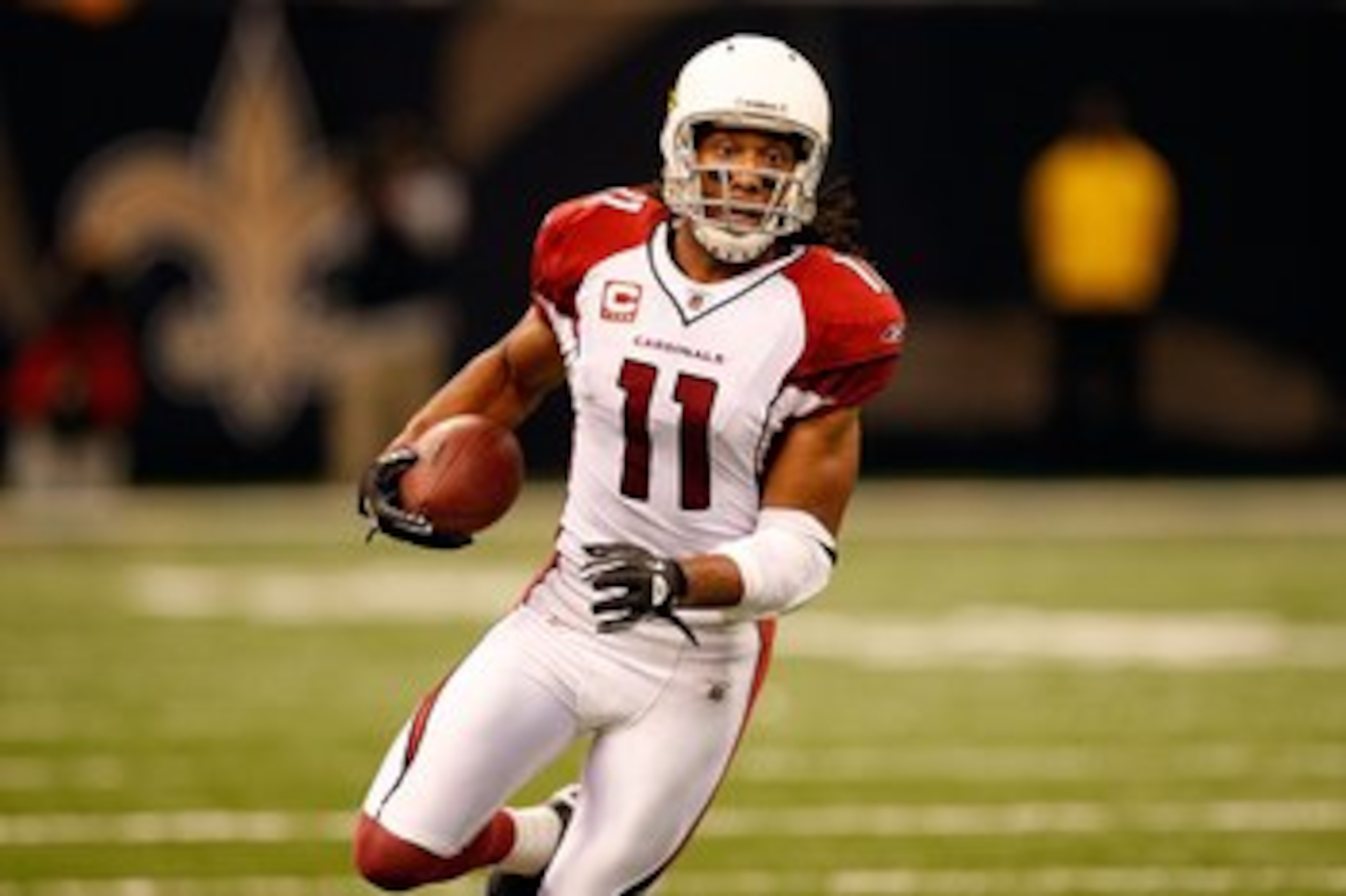 NEW ORLEANS - JANUARY 16:  Larry Fitzgerald #11 of the Arizona Cardinals runs for yards after the catch against the New Orleans Saints during the NFC Divisional Playoff Game at Louisana Superdome on January 16, 2010 in New Orleans, Louisiana. The Saints w