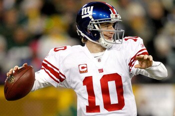 GREEN BAY, WI - DECEMBER 26:  Eli Manning #10 of the New York Giants throws against the Green Bay Packers at Lambeau Field on December 26, 2010 in Green Bay, Wisconsin.  (Photo by Matthew Stockman/Getty Images)
