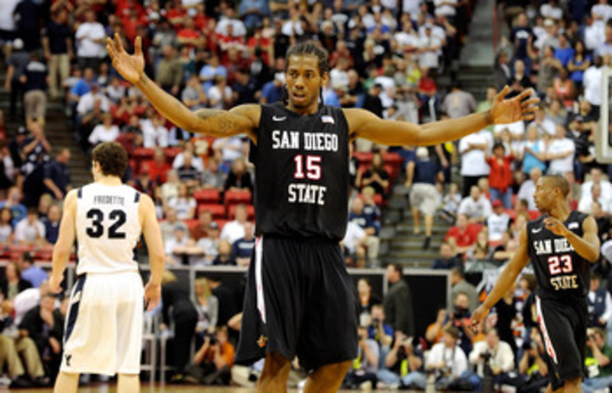 LAS VEGAS, NV - MARCH 12:  Kawhi Leonard #15 of the San Diego State Aztecs raises his arms in the last few seconds of the team's 72-54 victory over the Brigham Young University Cougars in the championship game of the Conoco Mountain West Conference Basket