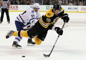 BOSTON, MA - MARCH 31:  Tyler Seguin #19 of the Boston Bruins is tripped by Darryl Boyce #47 of the Toronto Maple Leafs on March 31, 2011 at the TD Garden in Boston, Massachusetts.  (Photo by Elsa/Getty Images)