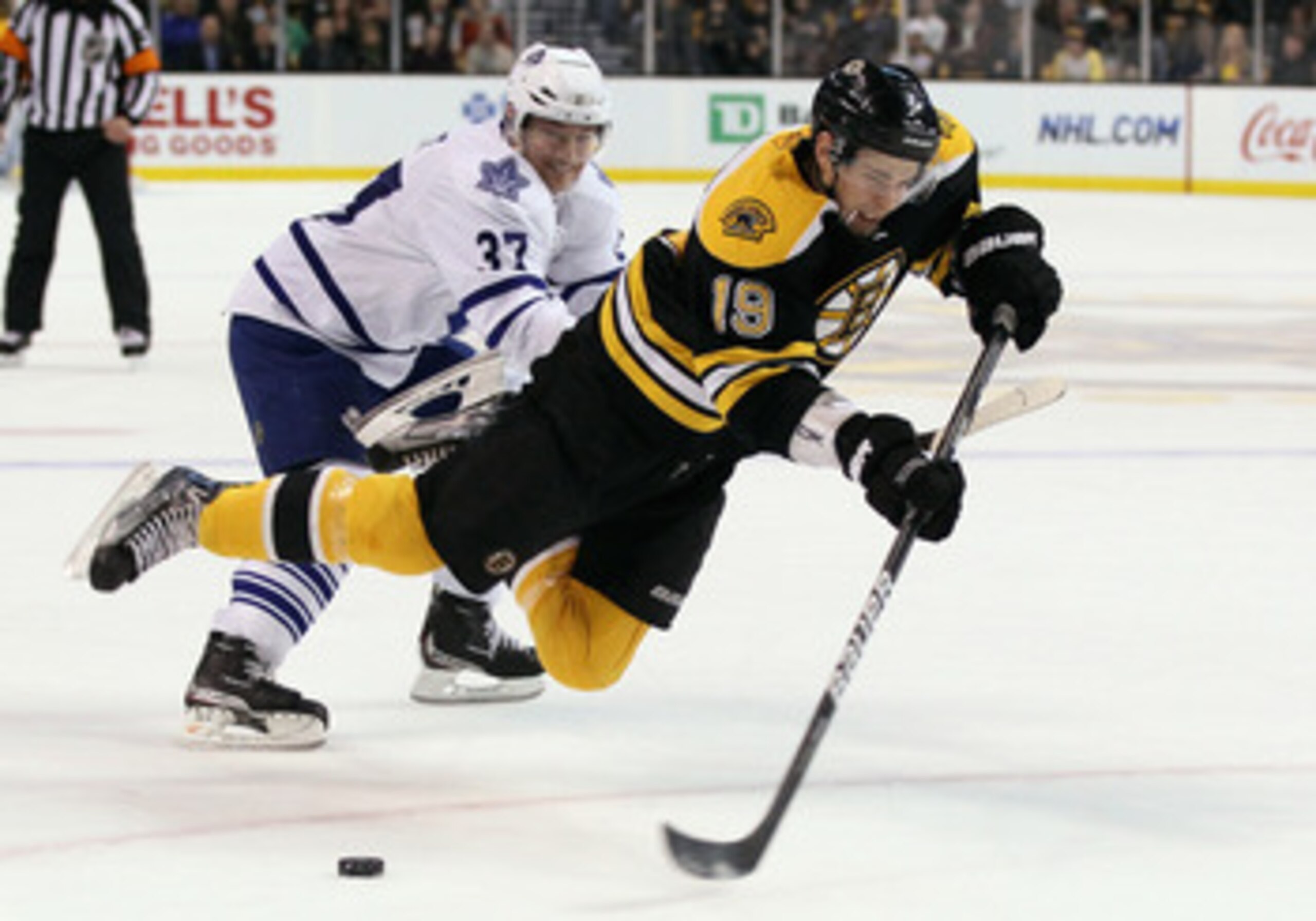 BOSTON, MA - MARCH 31:  Tyler Seguin #19 of the Boston Bruins is tripped by Darryl Boyce #47 of the Toronto Maple Leafs on March 31, 2011 at the TD Garden in Boston, Massachusetts.  (Photo by Elsa/Getty Images)