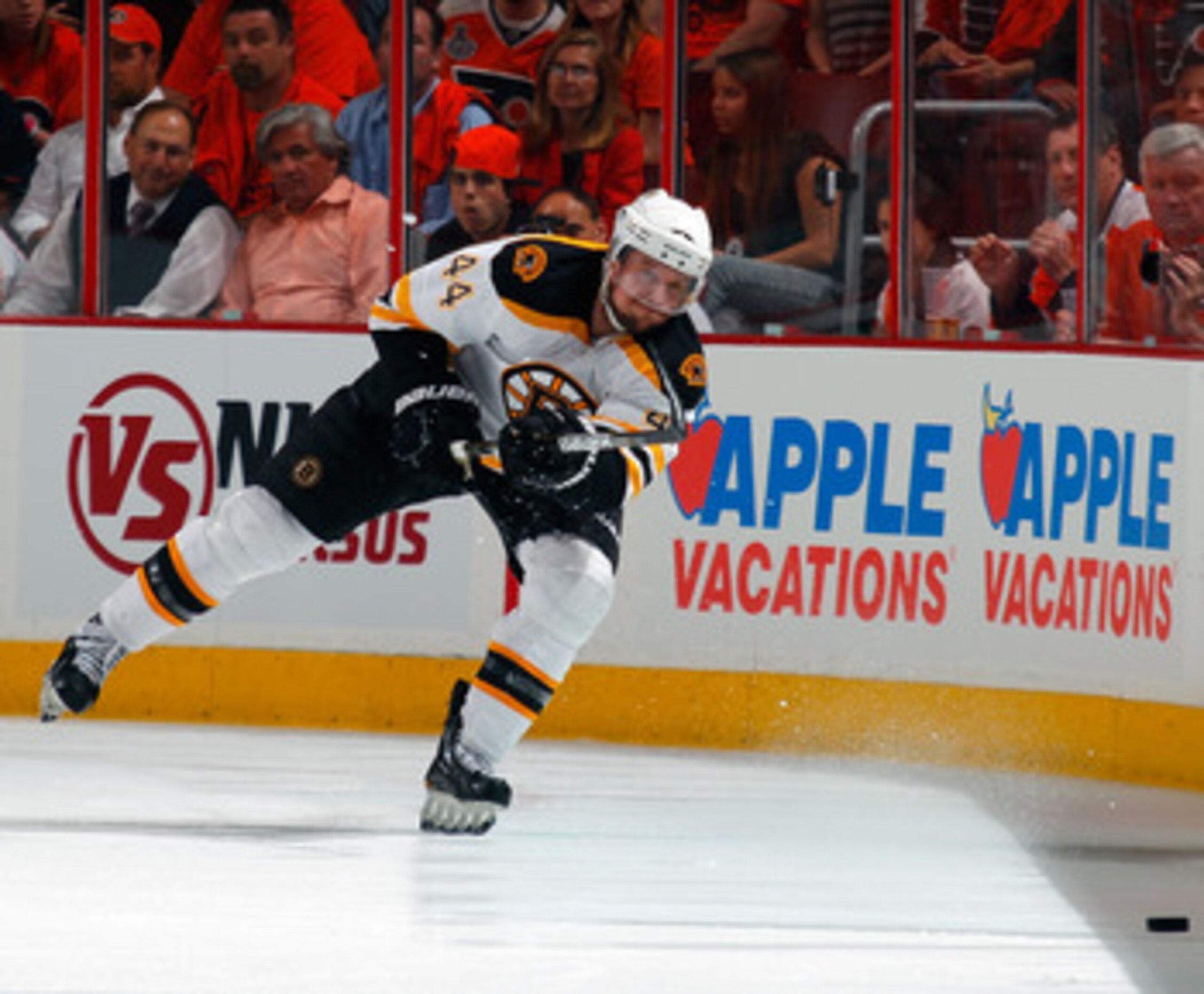 PHILADELPHIA, PA - MAY 02:  Dennis Seidenberg #44 of the Boston Bruins clears the puck during Game Two of the Eastern Conference Semifinals against the Philadelphia Flyers during the 2011 NHL Stanley Cup Playoffs at Wells Fargo Center on May 2, 2011 in Ph