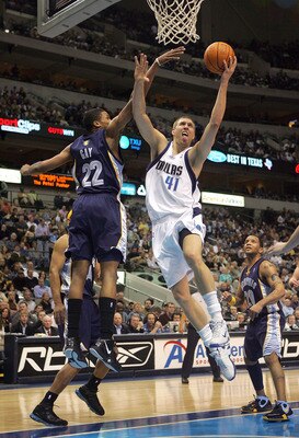 DALLAS - FEBRUARY 07:  Forward Dirk Nowitzki #41 of the Dallas Mavericks drives the hoop against Rudy Gay #22 of the Memphis Grizzlies on February 7, 2007 at the American Airlines Center in Dallas, Texas.  NOTE TO USER: User expressly acknowledges and agr