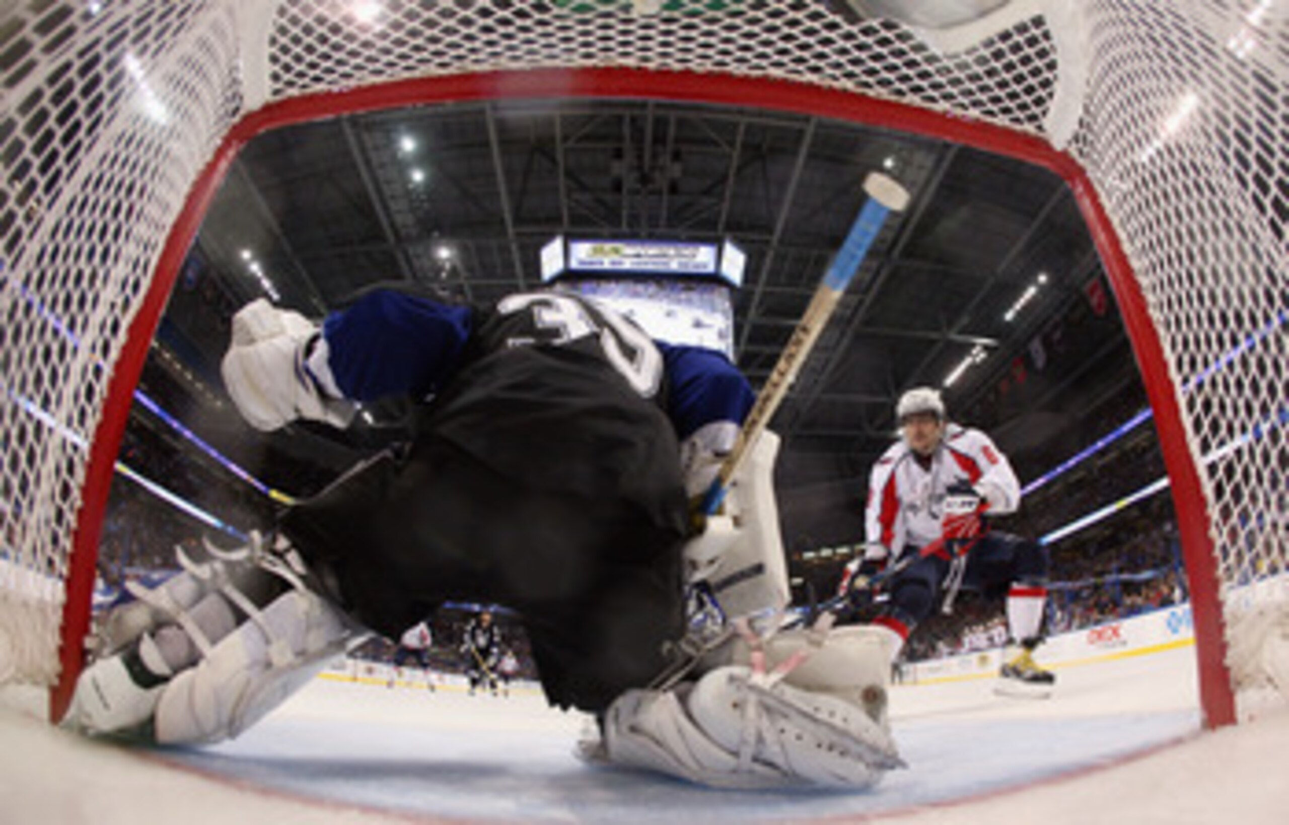 TAMPA, FL - MAY 04: Alex Ovechkin #8 of the Washington Capitals looks for a rebound from Dwayne Roloson #35 of the Tampa Bay Lightning in Game Four of the Eastern Conference Semifinals during the 2011 NHL Stanley Cup Playoffs at the St Pete Times Forum on