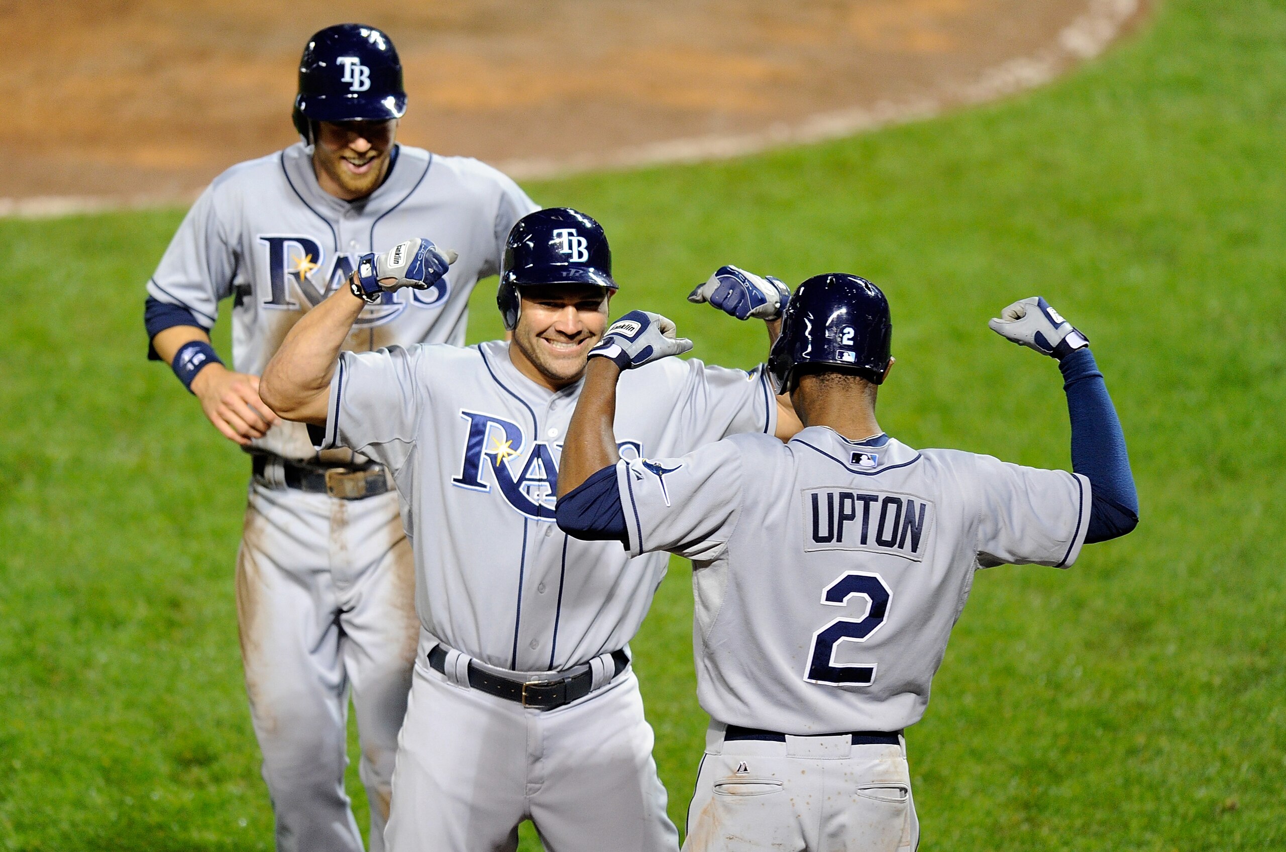 BALTIMORE, MD - MAY 06:  Johnny Damon #22 of the Tampa Bay Rays celebrates with Ben Zobrist #18 and B.J. Upton #2 after hitting a home run in the ninth inning against the Baltimore Orioles at Oriole Park at Camden Yards on May 6, 2011 in Baltimore, Maryla