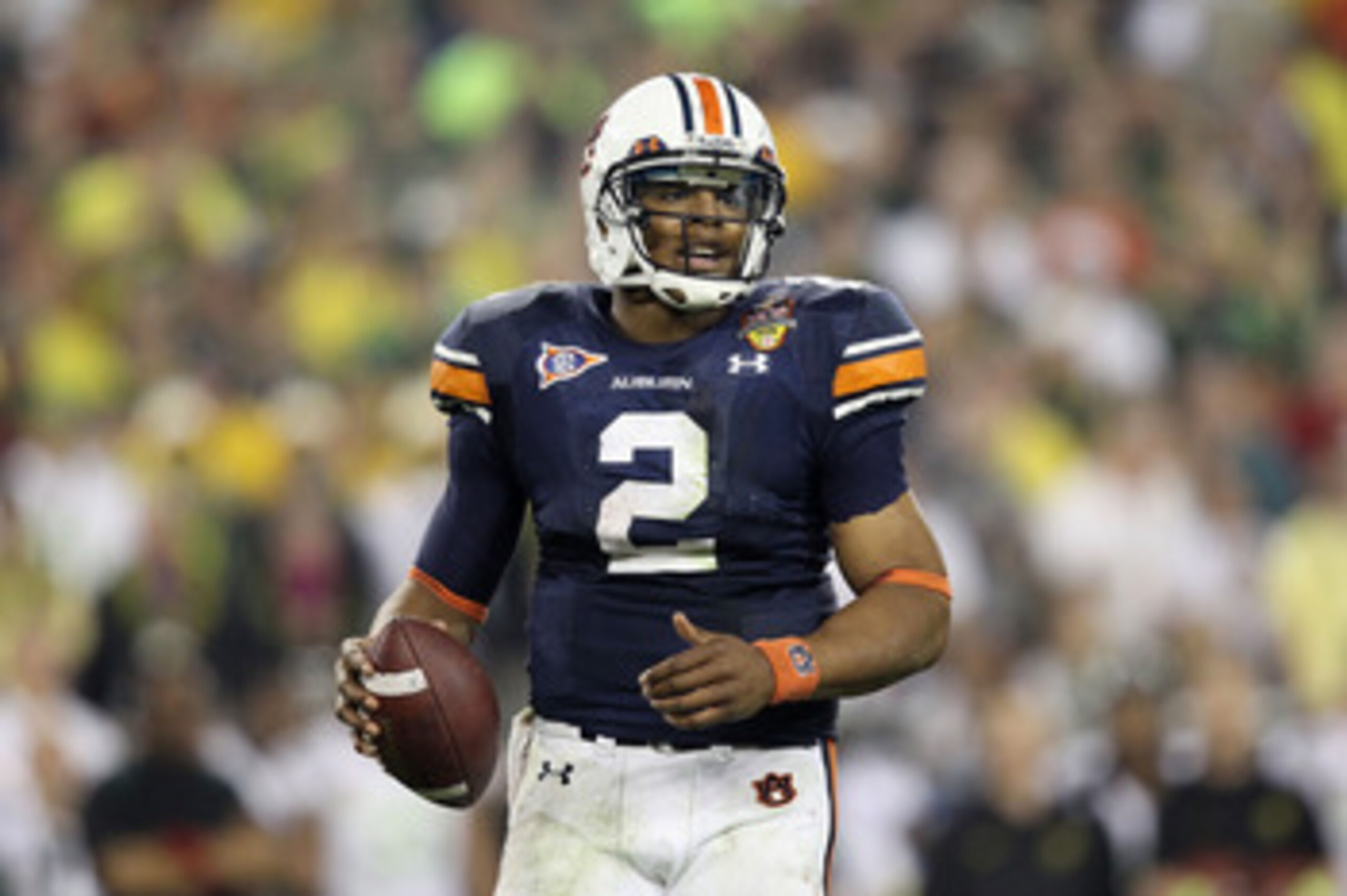GLENDALE, AZ - JANUARY 10: Cameron Newton #2 of the Auburn Tigers scrambles against the Oregon Ducks during the Tostitos BCS National Championship Game at University of Phoenix Stadium on January 10, 2011 in Glendale, Arizona. (Photo by Christian Peters GLENDALE, AZ - JANUARY 10: Cameron Newton #2 of the Auburn Tigers scrambles against the Oregon Ducks during the Tostitos BCS National Championship Game at University of Phoenix Stadium on January 10, 2011 in Glendale, Arizona. (Photo by Christian Peters