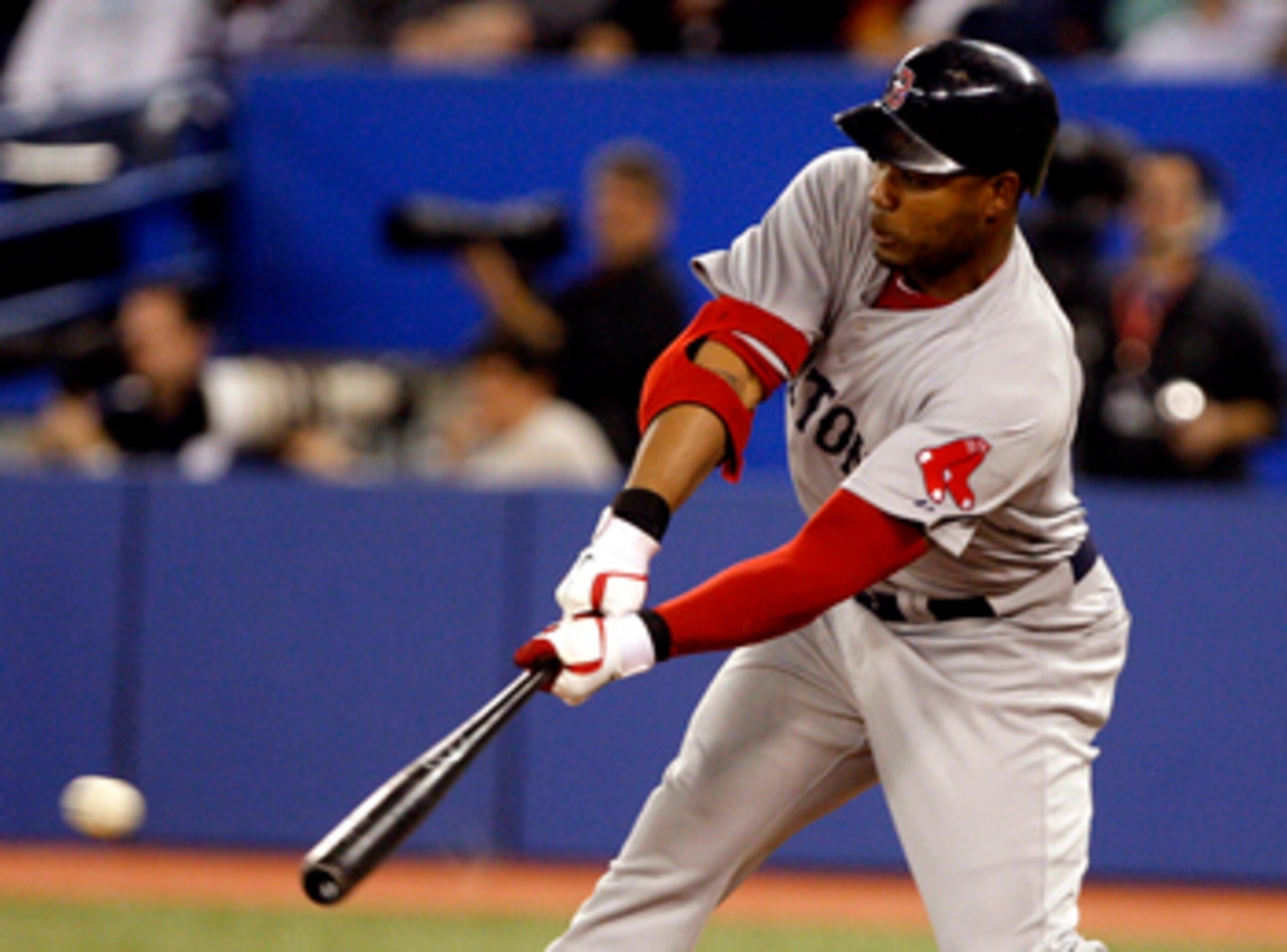 TORONTO, CANADA - MAY 10: Carl Crawford #13 of the Boston Red Sox hits a RBI during MLB action against the Toronto Blue Jays at the Rogers Centre May 10, 2011 in Toronto, Ontario, Canada. (Photo by Abelimages/Getty Images)
