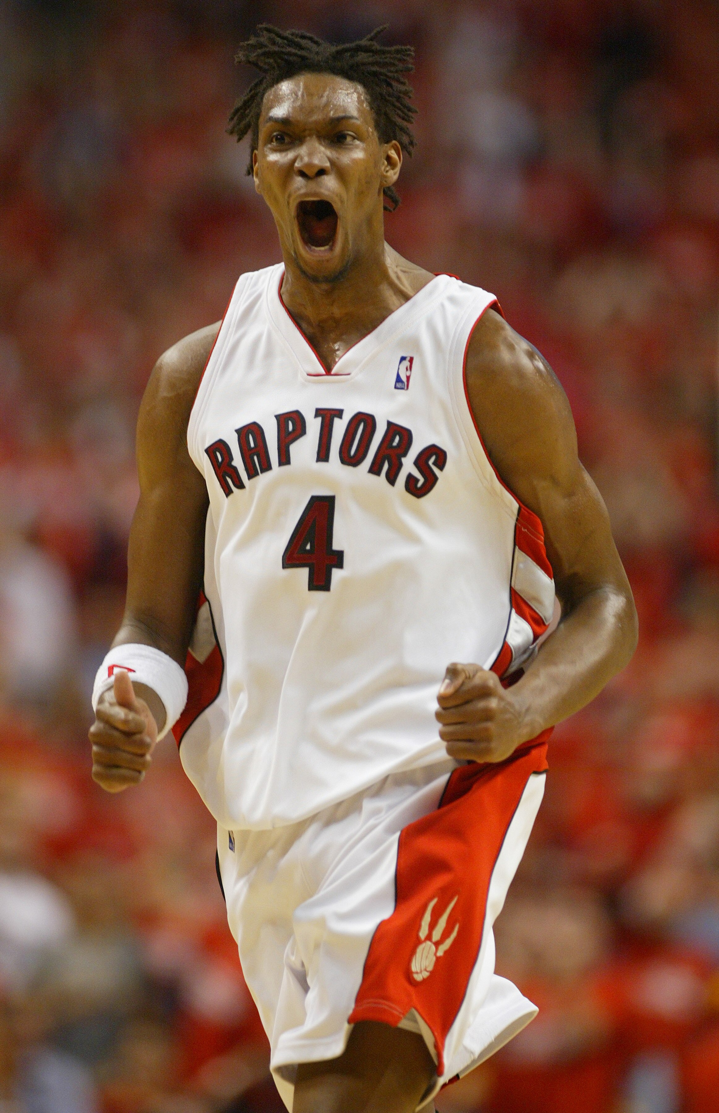 TORONTO,ON - APRIL 24:  Chris Bosh #4 of the Toronto Raptors celebrates another basket against the Orlando Magic in game 3 of the Eastern Conference quarterfinals on April 24, 2008 at the Air Canada Centre in Toronto, Ontario. (Photo by Claus Andersen/Get