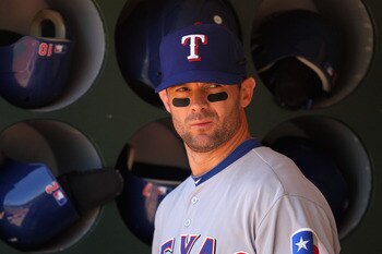 OAKLAND, CA - MAY 02:  Michael Young #10 of the Texas Rangers stands in the dugout before their game against the Oakland Athletics at Oakland-Alameda County Coliseum on May 2, 2011 in Oakland, California.  (Photo by Ezra Shaw/Getty Images)