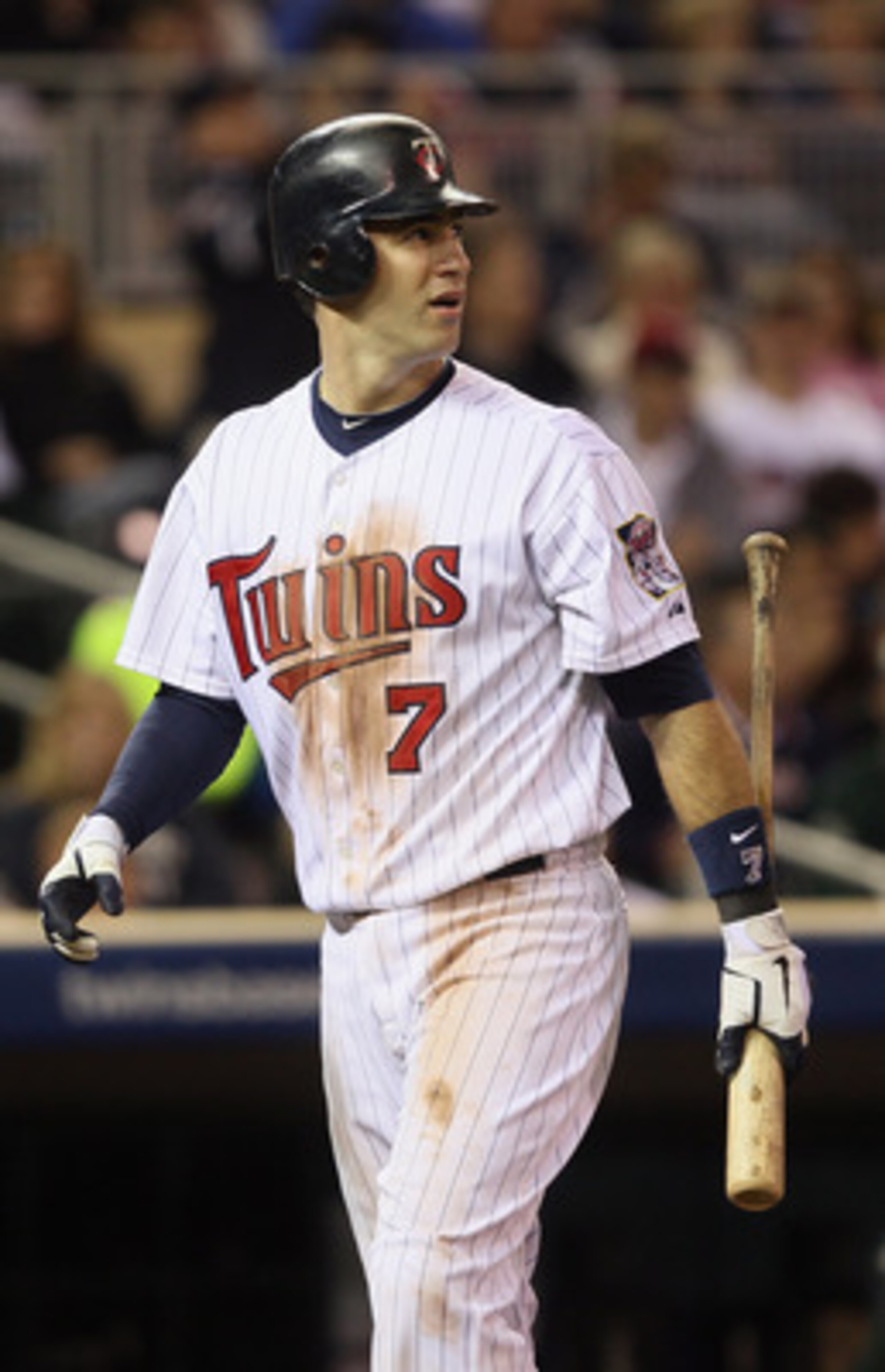 MINNEAPOLIS - OCTOBER 06:  Joe Mauer #7 of the Minnesota Twins reacts after he strikes out against the New York Yankees during game one of the ALDS on October 6, 2010 at Target Field in Minneapolis, Minnesota.  (Photo by Elsa/Getty Images)
