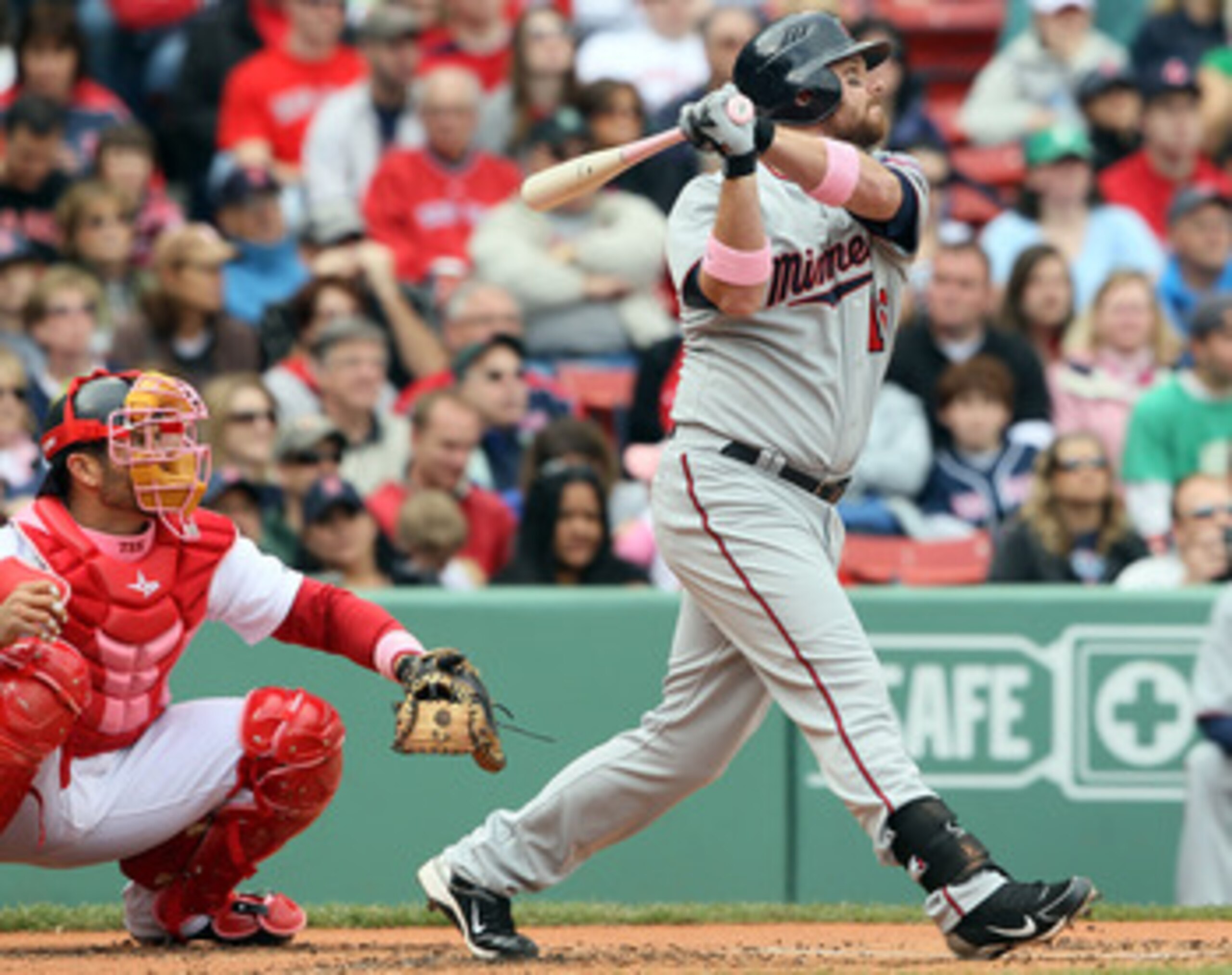 BOSTON, MA - MAY 08:  Jason Kubel #16 of the Minnesota Twins hits an RBI single in the first inning as Jason Varitek #33 of the Boston Red Sox catches on May 8, 2011 at Fenway Park in Boston, Massachusetts.  (Photo by Elsa/Getty Images)