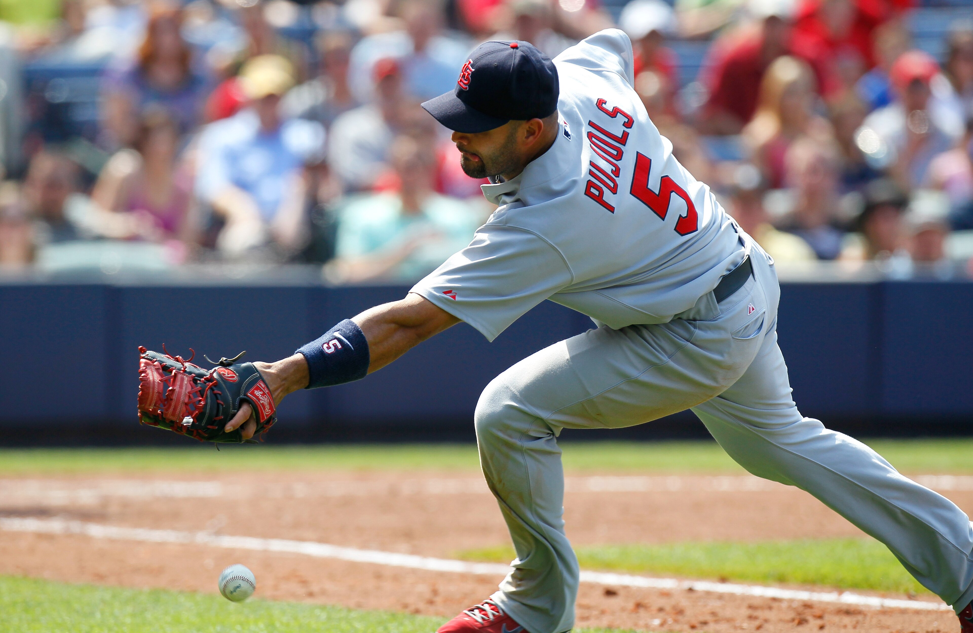 ATLANTA, GA - MAY 01: Albert Pujols #5 of the St. Louis Cardinals chases after a bunted foul ball hit by Alex Gonzalez #2 of the Atlanta Braves in the seventh inning at Turner Field on May 1, 2011 in Atlanta, Georgia. (Photo by Kevin C. Cox/Getty Images ATLANTA, GA - MAY 01: Albert Pujols #5 of the St. Louis Cardinals chases after a bunted foul ball hit by Alex Gonzalez #2 of the Atlanta Braves in the seventh inning at Turner Field on May 1, 2011 in Atlanta, Georgia. (Photo by Kevin C. Cox/Getty Images