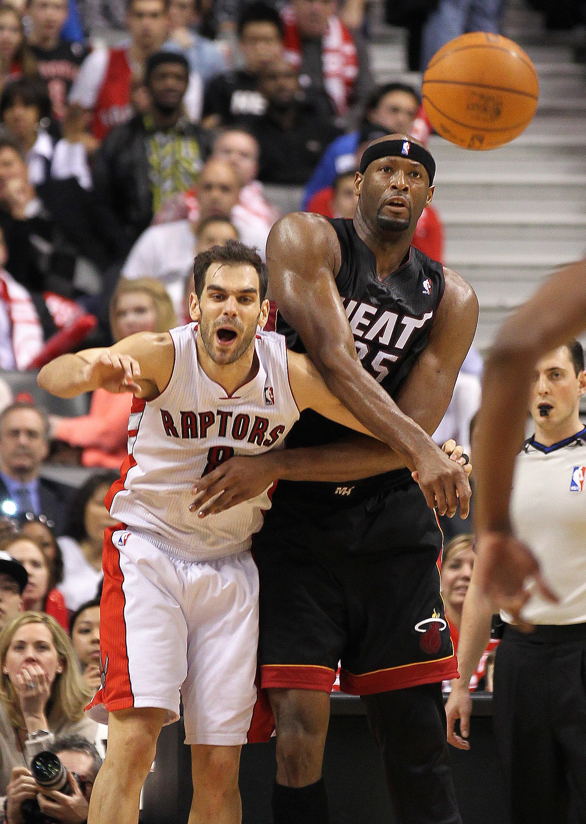 TORONTO, CANADA - FEBRUARY 16:  Erick Dampier #25 of the Miami Heat gets a pass away while being guarded by Jose Calderon #8 of the Toronto Raptors in a game on February 16, 2011 at the Air Canada Centre in Toronto, Canada. The Heat defeated the Raptors 1