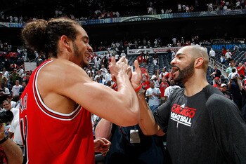 ATLANTA, GA - MAY 12:  Joakim Noah #13 and Carlos Boozer #5 of the Chicago Bulls celebrate after their 93-73 win over the Atlanta Hawks in Game Six of the Eastern Conference Semifinals in the 2011 NBA Playoffs at Phillips Arena on May 12, 2011 in Atlanta,