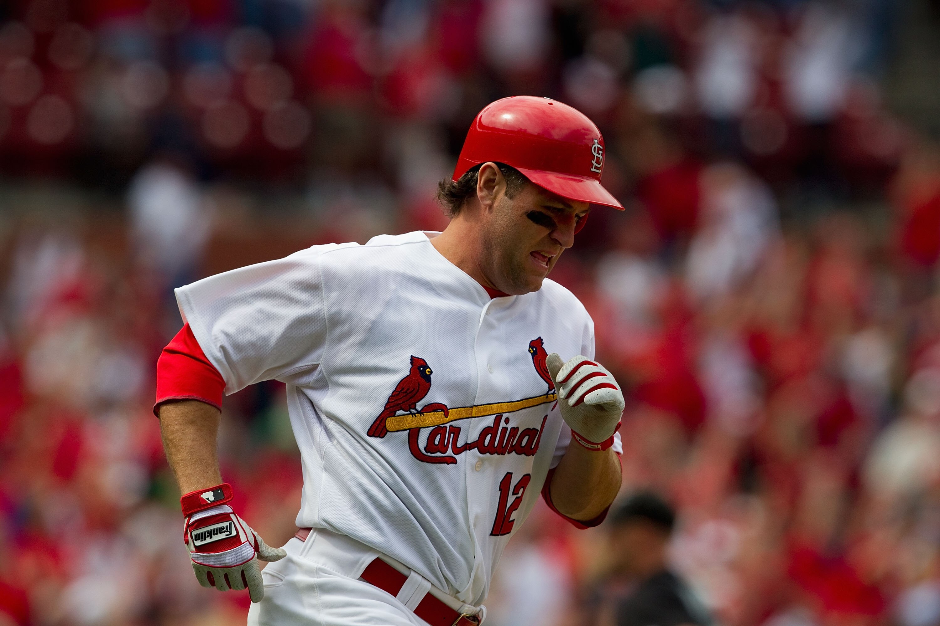 ST. LOUIS, MO - MAY 5: Lance Berkman #12 of the St. Louis Cardinals rounds the bases after hitting the game-winning three-run home run against the Florida Marlins at Busch Stadium on May 5, 2011 in St. Louis, Missouri.  (Photo by Dilip Vishwanat/Getty Ima