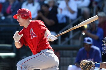 SURPRISE, AZ - MARCH 02:  Mike Trout #90 of the Los Angeles Angels of Anaheim hits a single against the Texas Rangers during the second inning of the spring training game at Surprise Stadium on March 2, 2011 in Surprise, Arizona.  (Photo by Christian Pete