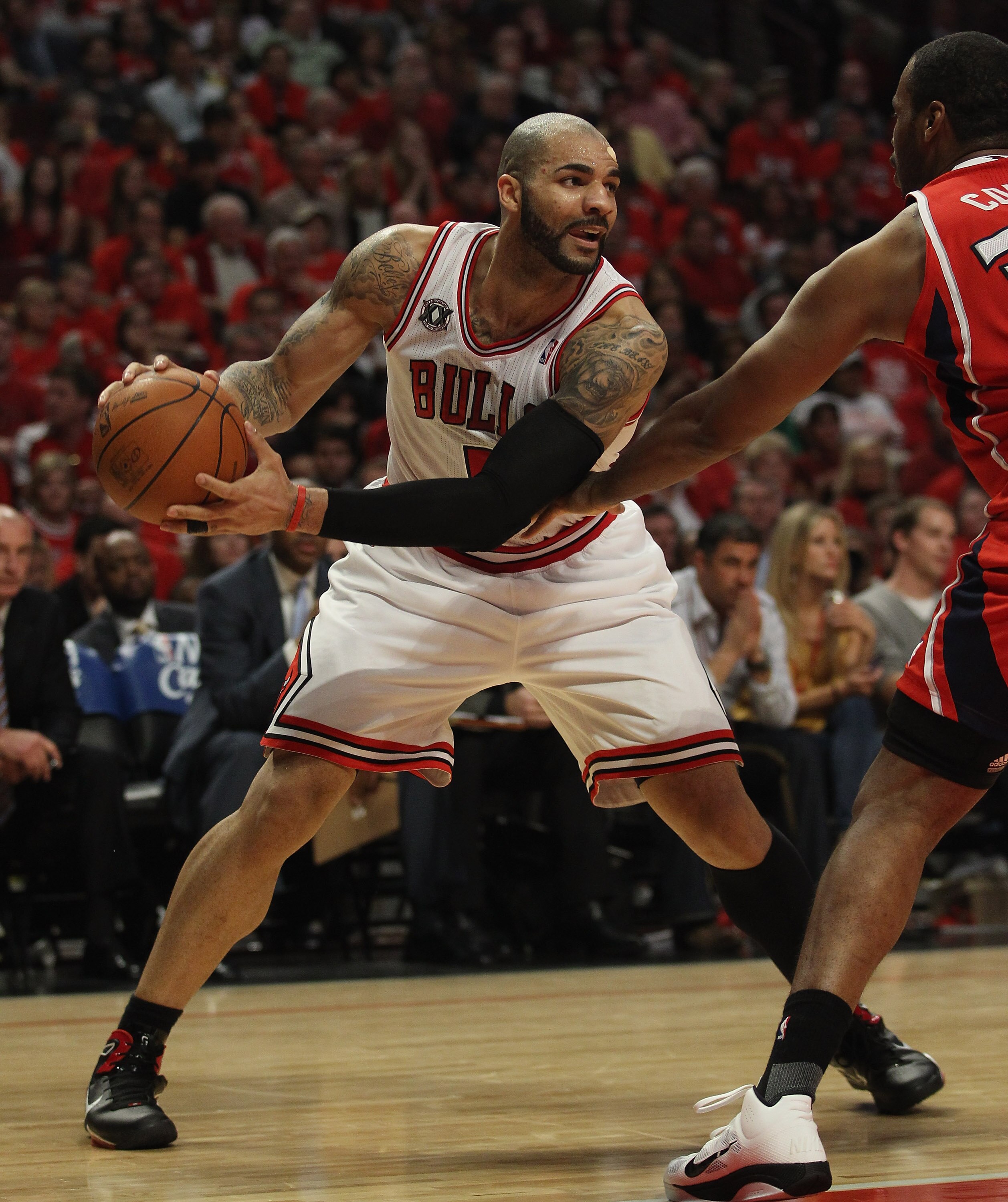 CHICAGO, IL - MAY 10: Carlos Boozer #5 of the Chicago Bulls looks to pass against the Atlanta Hawks in Game Five of the Eastern Conference Semifinals in the 2011 NBA Playoffs at the United Center on May 10, 2011 in Chicago, Illinois. The Bulls defeated th