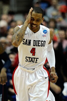 ANAHEIM, CA - MARCH 24:  Malcolm Thomas #4 of the San Diego State Aztecs reacts after drawing contact while playing against the Connecticut Huskies during the west regional semifinal of the 2011 NCAA men's basketball tournament at the Honda Center on Marc
