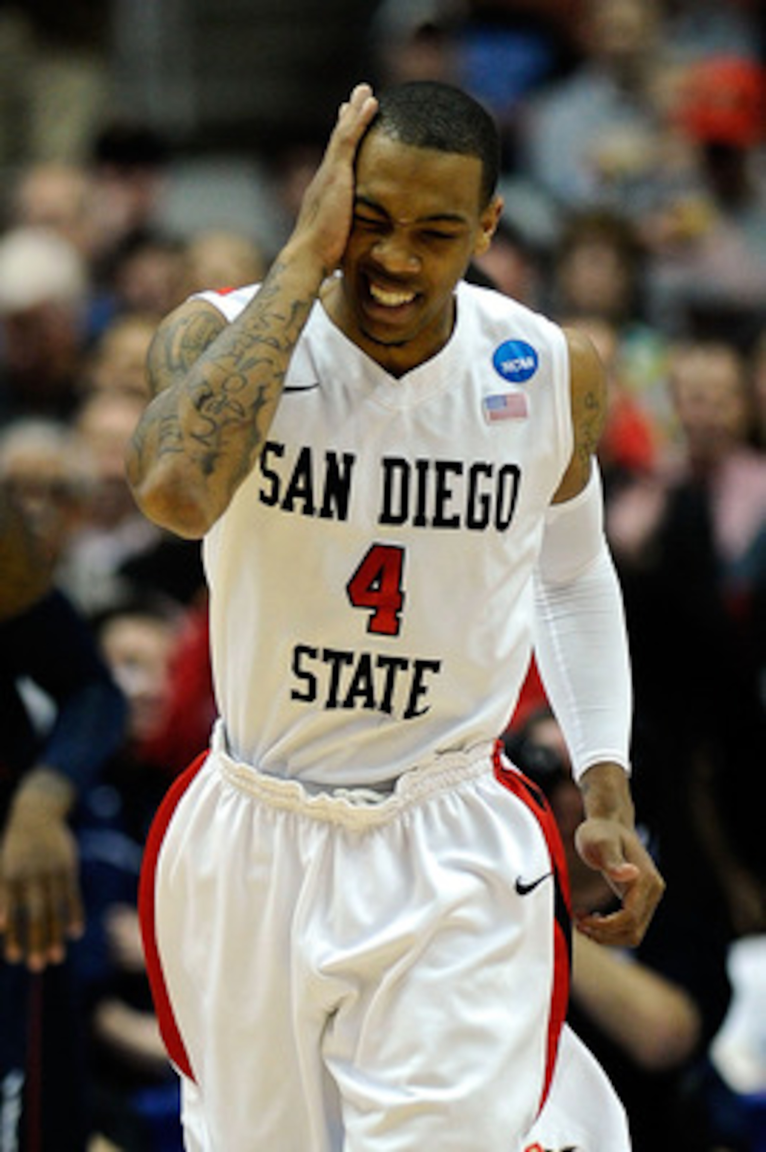 ANAHEIM, CA - MARCH 24:  Malcolm Thomas #4 of the San Diego State Aztecs reacts after drawing contact while playing against the Connecticut Huskies during the west regional semifinal of the 2011 NCAA men's basketball tournament at the Honda Center on Marc