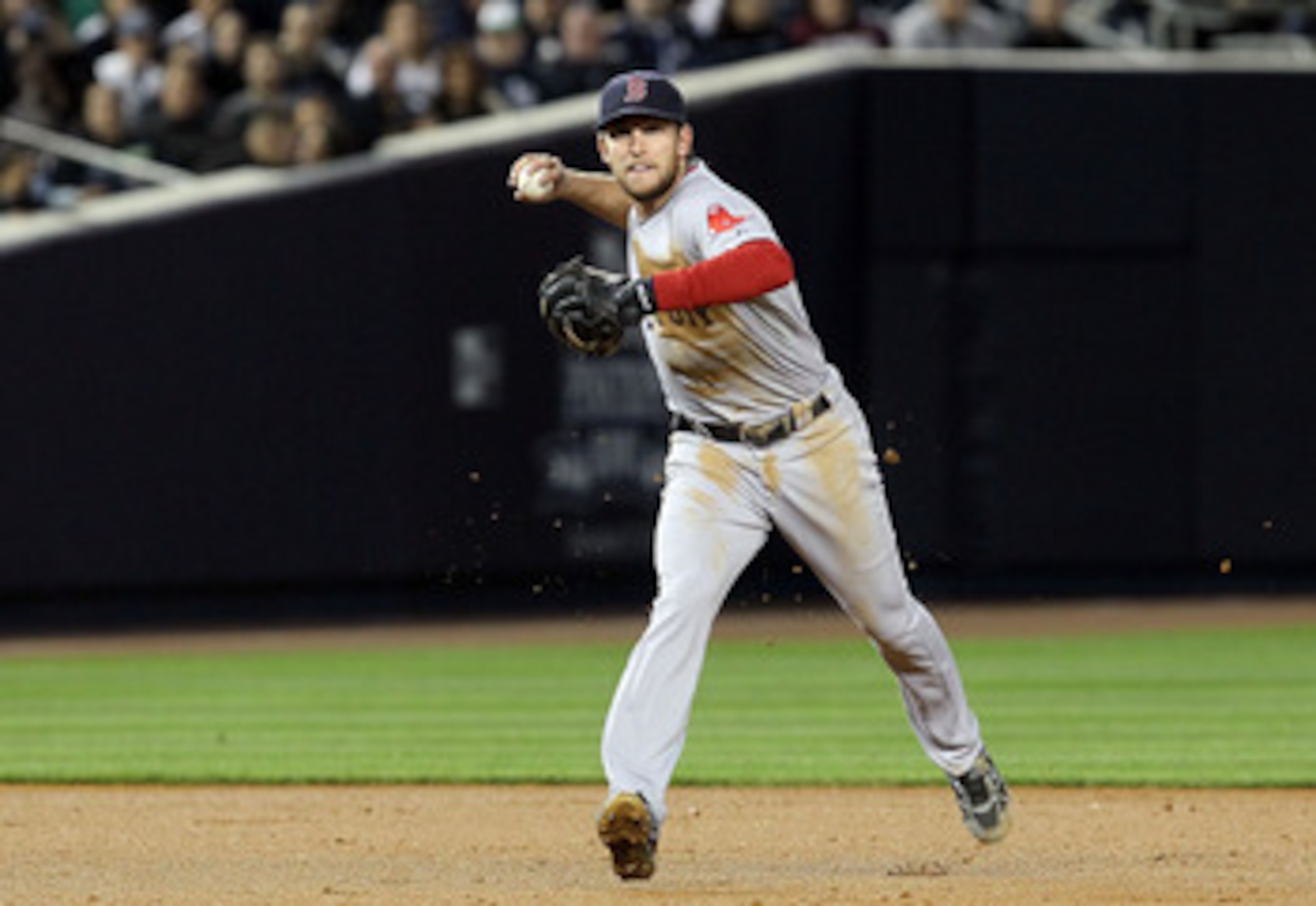 NEW YORK, NY - MAY 14:  Jed Lowrie #12 of the Boston Red Sox throws out Derek Jeter (not pictured) of the New York Yankees in the third inning on May 14, 2011 at Yankee Stadium in the Bronx borough of New York City.  (Photo by Jim McIsaac/Getty Images)