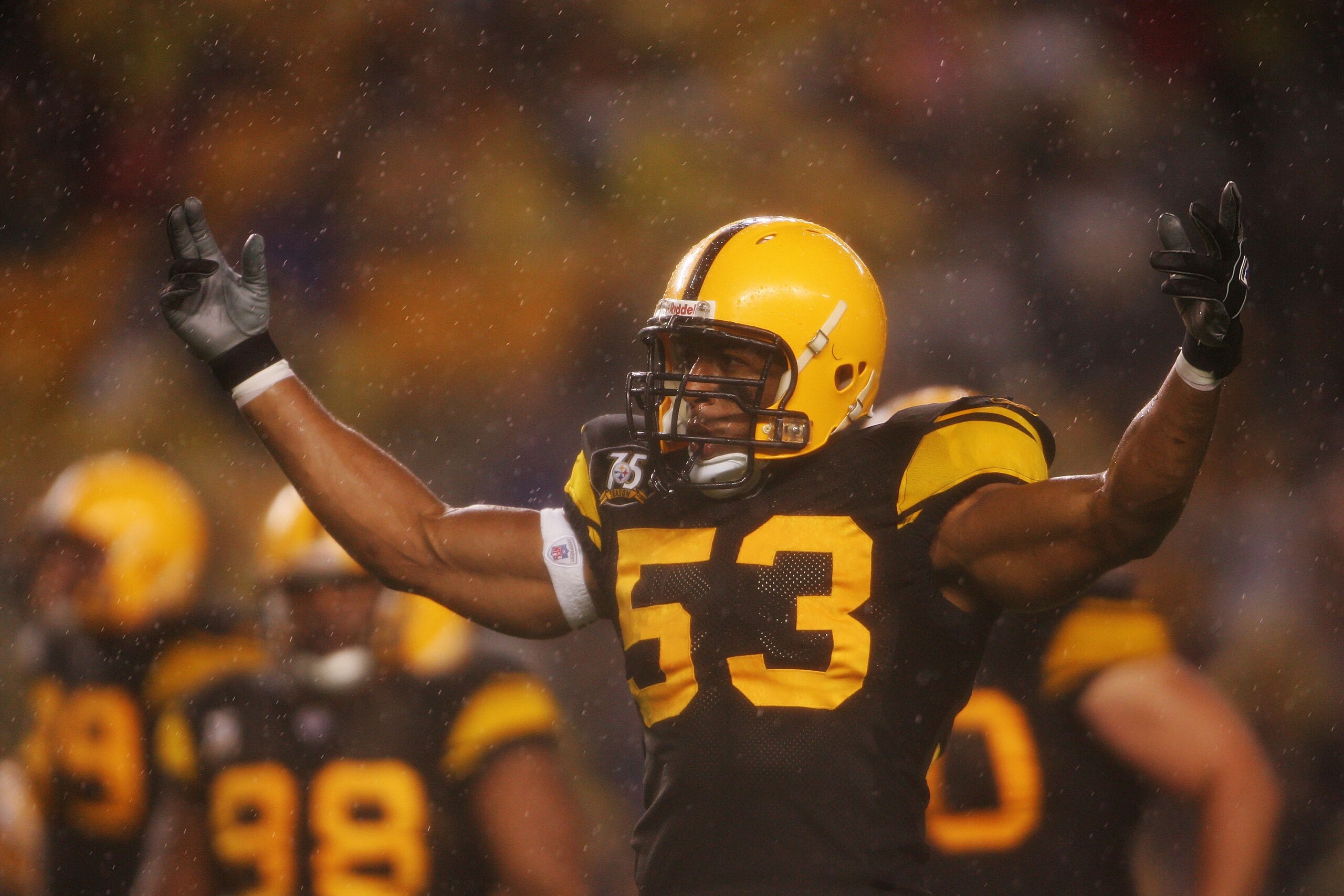 PITTSBURGH - NOVEMBER 05: Clark Haggans #53 of the Pittsburgh Steelers pumps the crowd up in the rain  against the  Baltimore Ravens on November 5, 2007 at Heinz Field in Pittsburgh, Pennsylvania.  (Photo by Chris McGrath/Getty Images)