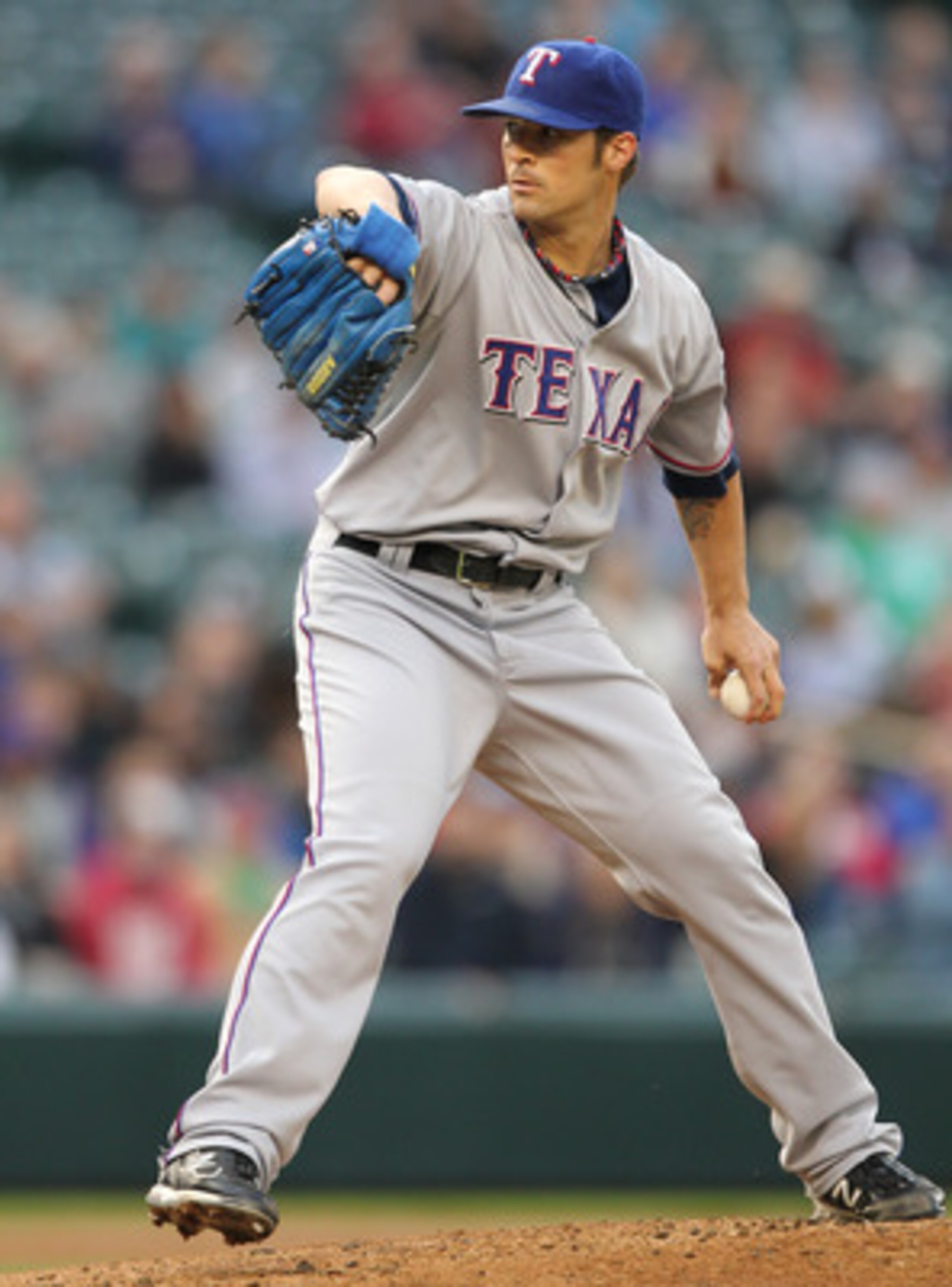 SEATTLE - MAY 04:  Starting pitcher C.J. Wilson #36 of the Texas Rangers pitches against the Seattle Mariners at Safeco Field on May 4, 2011 in Seattle, Washington. (Photo by Otto Greule Jr/Getty Images)