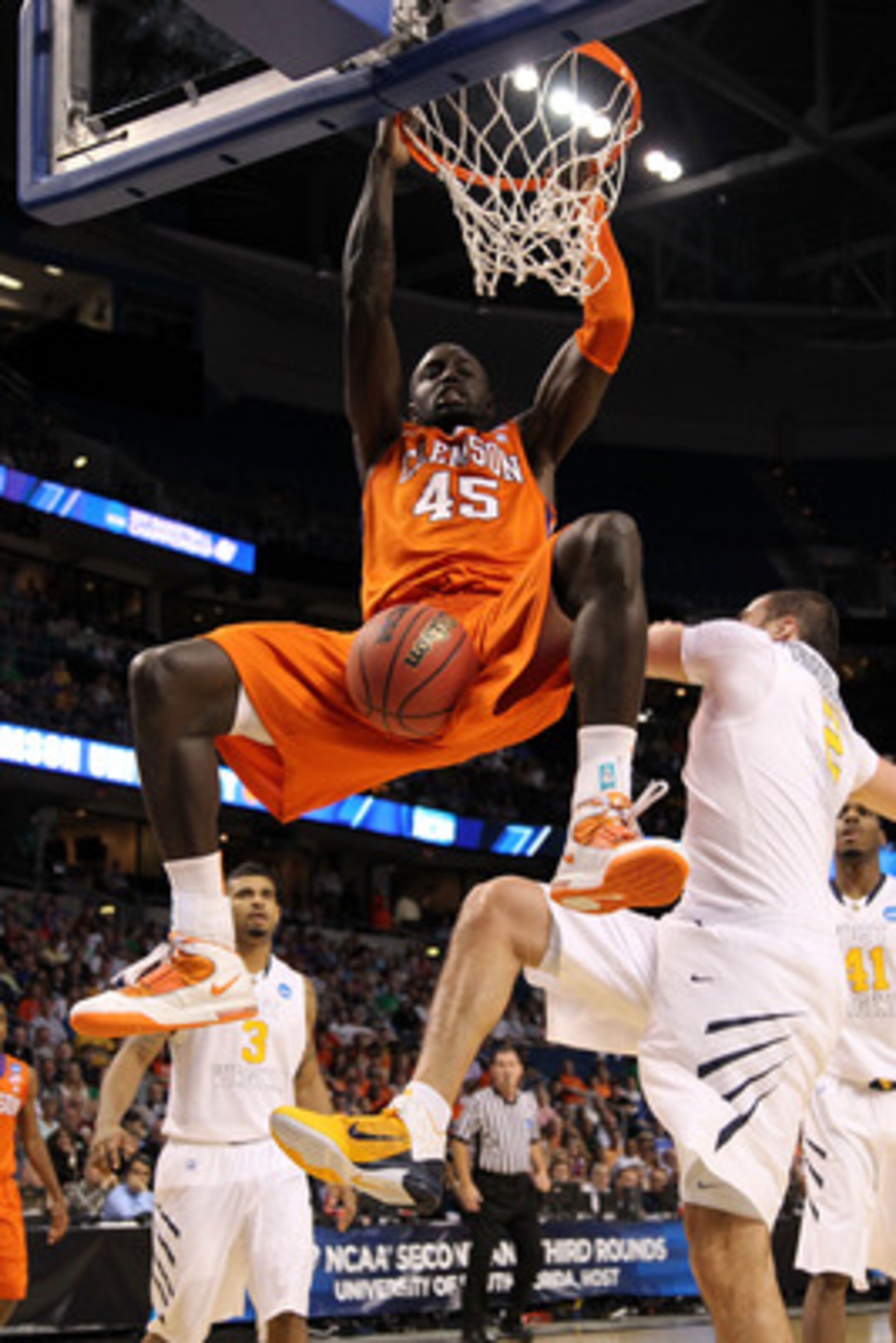 TAMPA, FL - MARCH 17:  Jerai Grant #45 of the Clemson Tigers dunks in the first half against the West Virginia Mountaineers during the second round of the 2011 NCAA men's basketball tournament at St. Pete Times Forum on March 17, 2011 in Tampa, Florida.