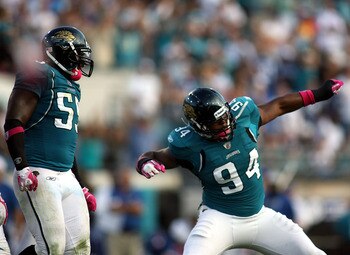 JACKSONVILLE, FL - OCTOBER 03:  Lineman Jeremy Mincey #94 of the Jacksonville Jaguars celebrates with Kirk Morreson after sacking Quarterback Peyton Manning #18 of the Indianapolis Colts at EverBank Field on October 3, 2010 in Jacksonville, Florida.  (Pho
