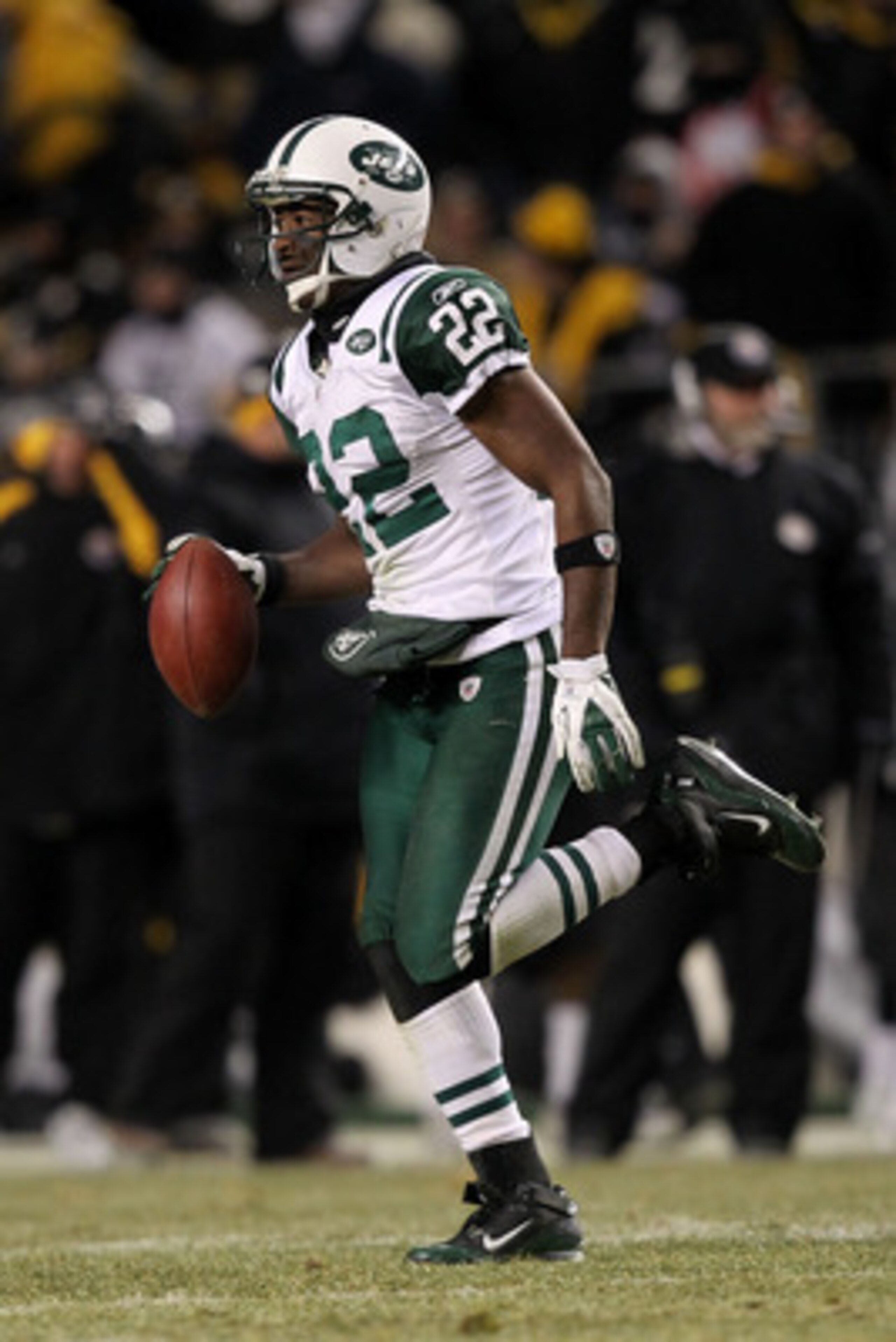 PITTSBURGH, PA - JANUARY 23:  Brodney Pool #22 of the New York Jets runs down field after intercepting a pass intended for Emmanuel Sanders #88 of the Pittsburgh Steelers in the third quarter of the 2011 AFC Championship game at Heinz Field on January 23,