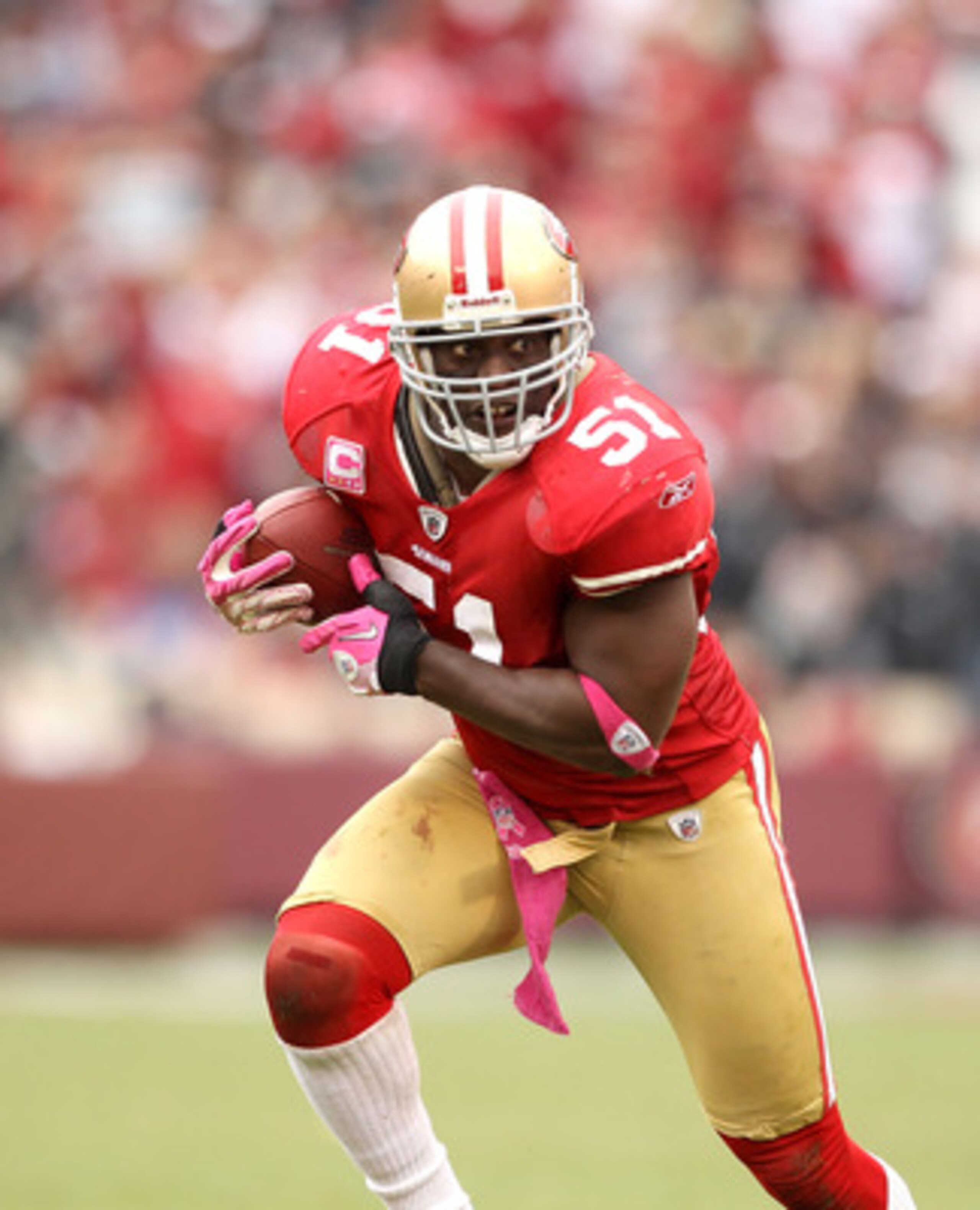 SAN FRANCISCO - OCTOBER 17:  Takeo Spikes #51 of the San Francisco 49ers returns an interception against the Oakland Raiders at Candlestick Park on October 17, 2010 in San Francisco, California.  (Photo by Ezra Shaw/Getty Images)