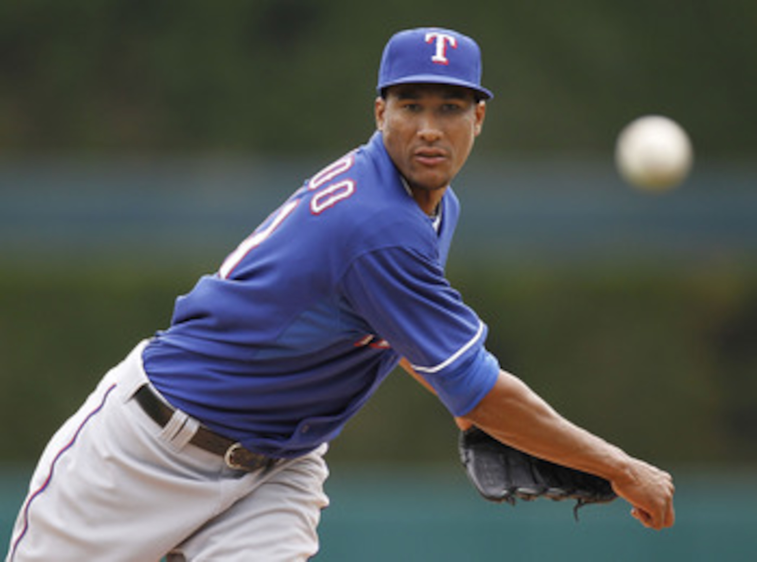 DETROIT, MI - APRIL 11:  Alexi Ogando #41 of the Texas Rangers throws a pitch while playing the Detroit Tigers at Comerica Park on April 11, 2011 in Detroit, Michigan.  (Photo by Gregory Shamus/Getty Images)