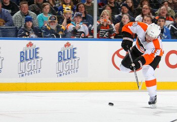 BUFFALO NY - JANUARY 11:  Scott Hatnell #19 of the Philadelphia Flyers shoots the puck into the empty net against the Buffalo Sabres during their NHL game at HSBC Arena January 11, 2011 in Buffalo, New York. (Photo By Dave Sandford/Getty Images)