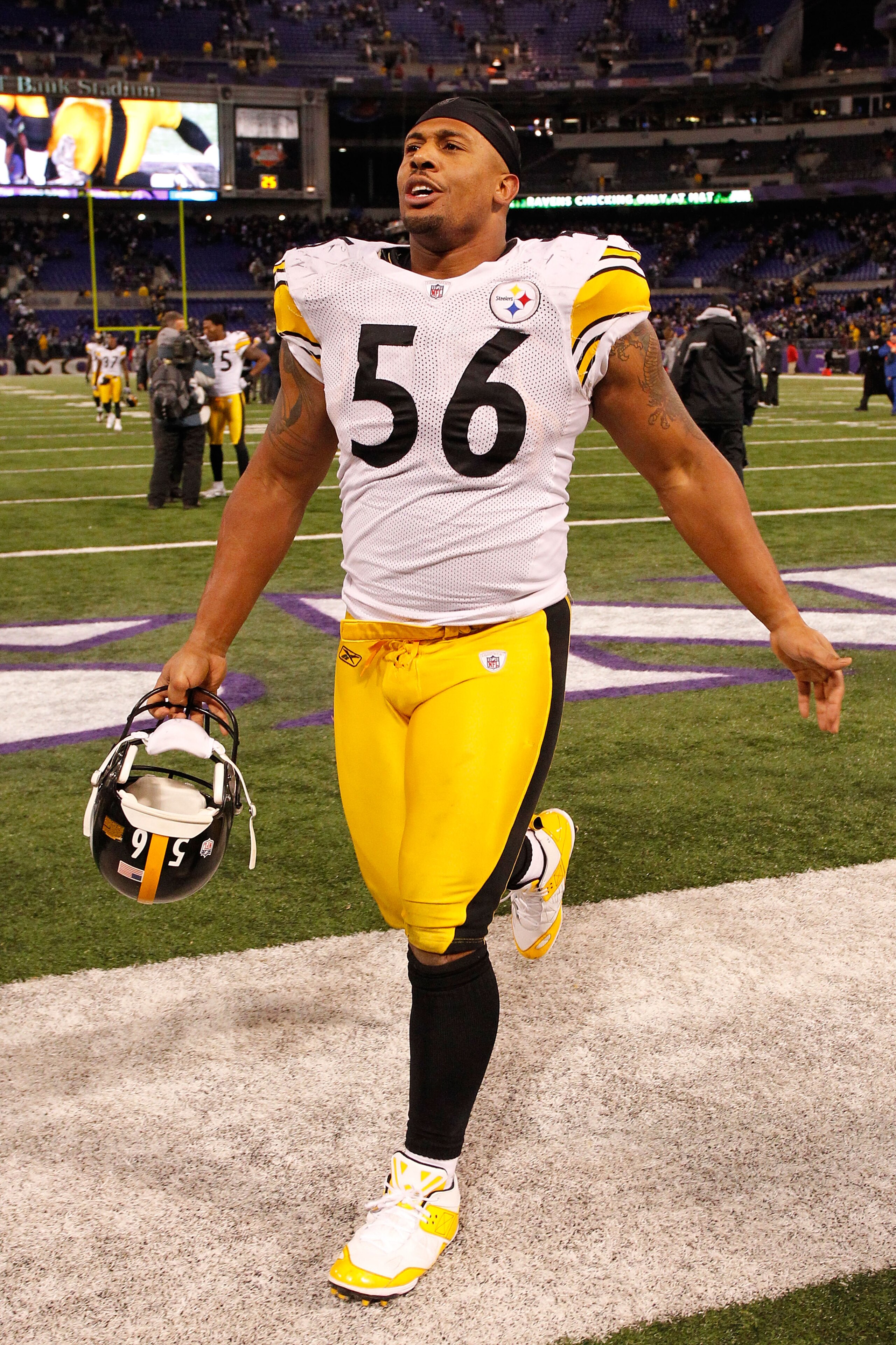 BALTIMORE, MD - DECEMBER 05:  Linebacker LaMarr Woodley #56 of the Pittsburgh Steelers smiles as he walks off the field after defeating the Baltimore Ravens 13-10 at M&T Bank Stadium on December 5, 2010 in Baltimore, Maryland.  (Photo by Geoff Burke/Getty