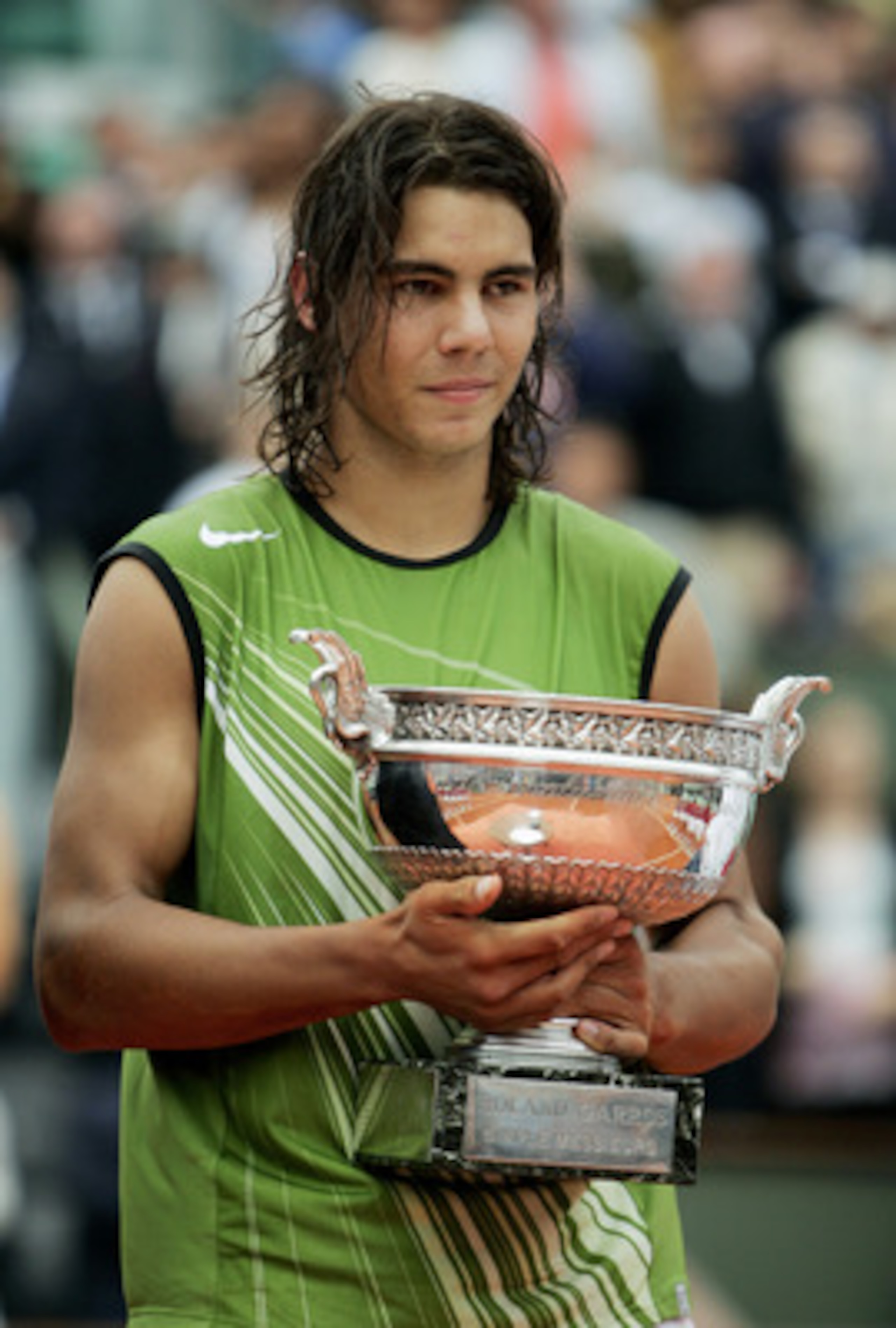 PARIS - JUNE 05: Rafael Nadal of Spain celebrates with the trophy at the end of the Mens Final match on the fourteenth day of the French Open at Roland Garros on June 5, 2005 in Paris, France. (Photo by Clive Mason/Getty Images) PARIS - JUNE 05: Rafael Nadal of Spain celebrates with the trophy at the end of the Mens Final match on the fourteenth day of the French Open at Roland Garros on June 5, 2005 in Paris, France. (Photo by Clive Mason/Getty Images)