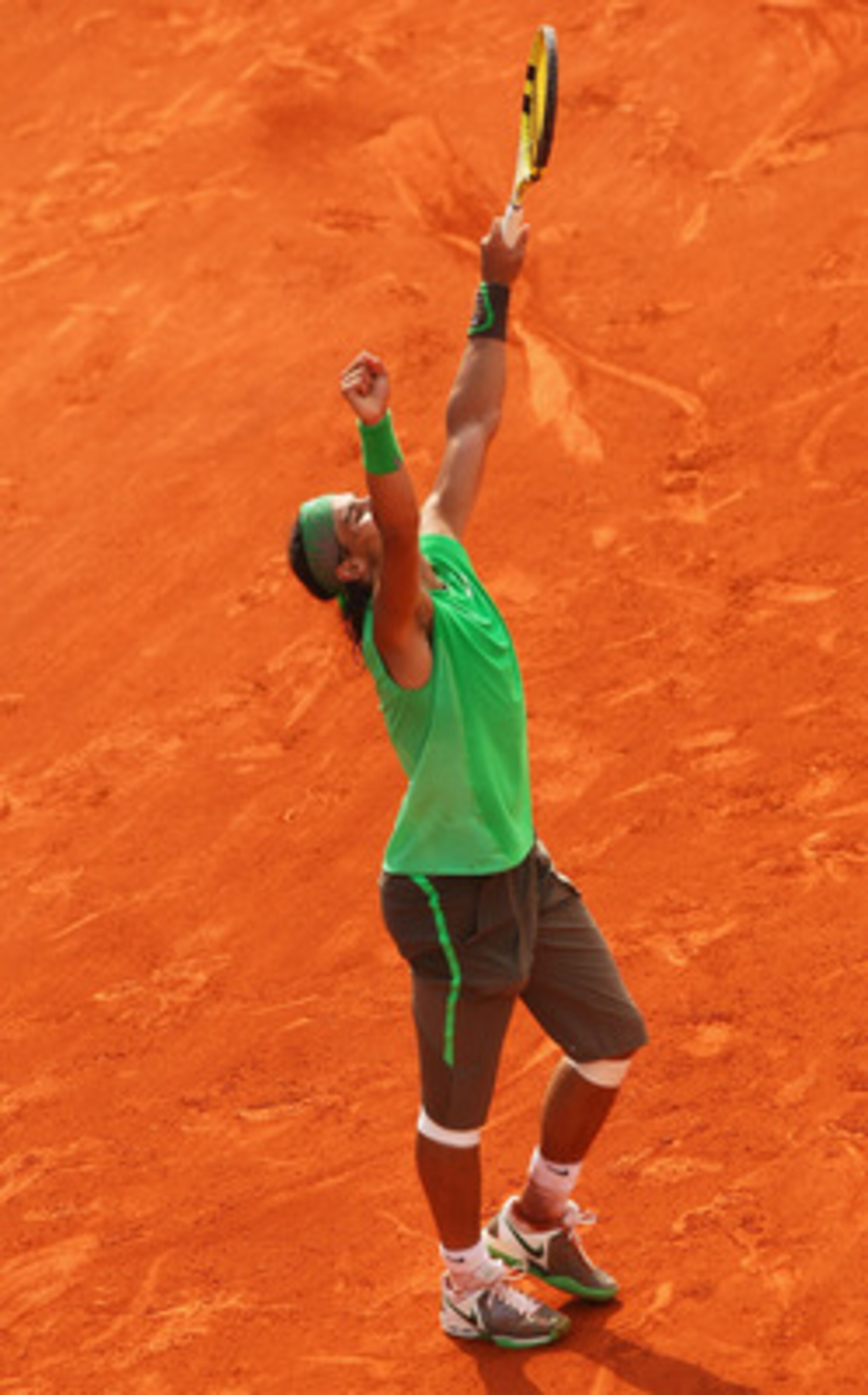 PARIS - JUNE 08: Rafael Nadal of Spain celebrates as he clinches victory during the Men's Singles Final match against Roger Federer of Switzerland on day fifteen of the French Open at Roland Garros on June 8, 2008 in Paris, France. (Photo by Mike Hewitt PARIS - JUNE 08: Rafael Nadal of Spain celebrates as he clinches victory during the Men's Singles Final match against Roger Federer of Switzerland on day fifteen of the French Open at Roland Garros on June 8, 2008 in Paris, France. (Photo by Mike Hewitt