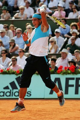 PARIS - JUNE 10:  Rafael Nadal of Spain in action against Roger Federer of Switzerland during the Men's Singles Final on day fifteen of the French Open at Roland Garros on June 10, 2007 in Paris, France.  (Photo by Dean Mouhtaropoulos/Getty Images)