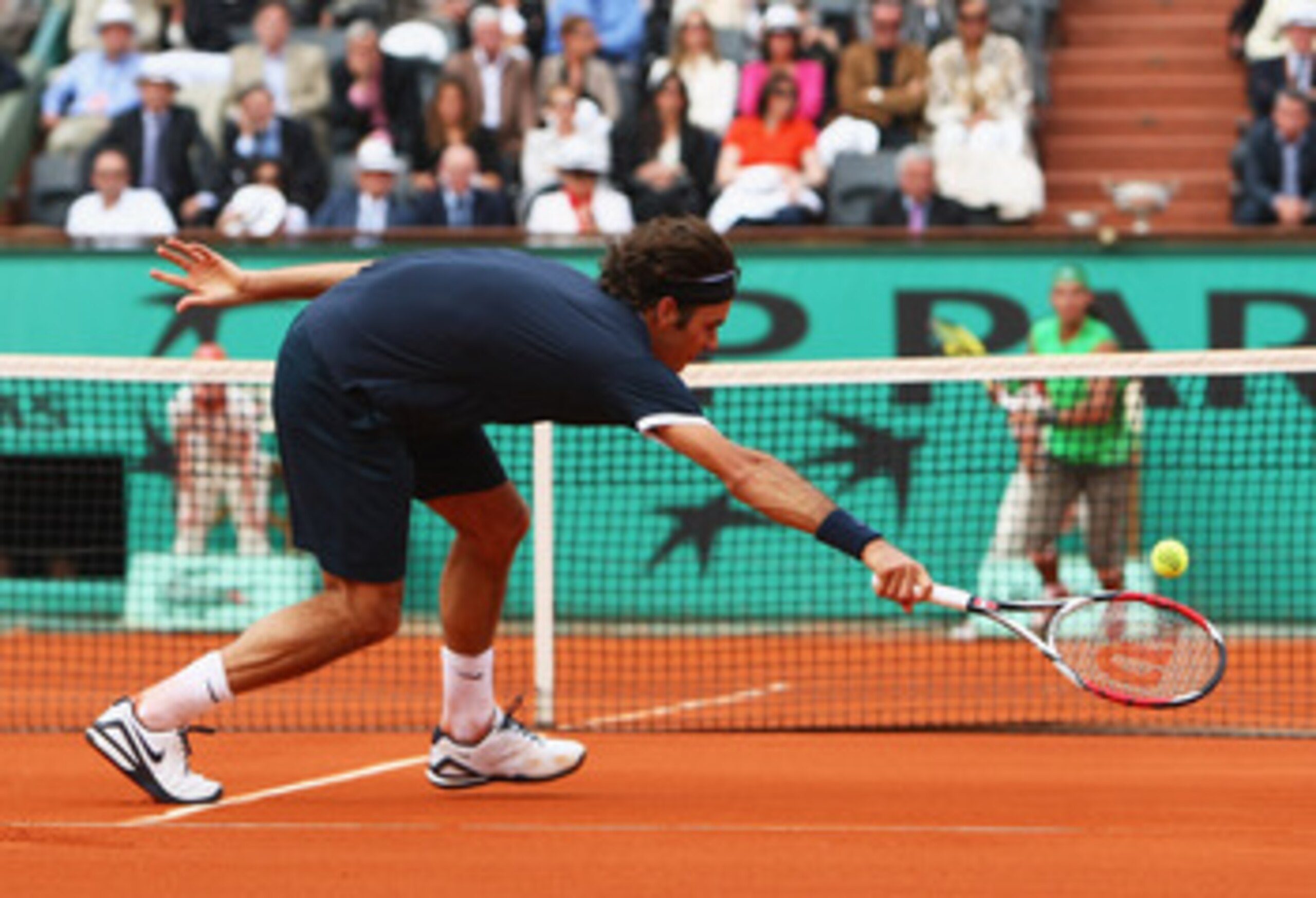 PARIS - JUNE 08: Roger Federer of Switzerland stretches for a forehand during the Men's Singles Final match against Rafael Nadal of Spain on day fifteen of the French Open at Roland Garros on June 8, 2008 in Paris, France. (Photo by Mike Hewitt/Getty Im PARIS - JUNE 08: Roger Federer of Switzerland stretches for a forehand during the Men's Singles Final match against Rafael Nadal of Spain on day fifteen of the French Open at Roland Garros on June 8, 2008 in Paris, France. (Photo by Mike Hewitt/Getty Im