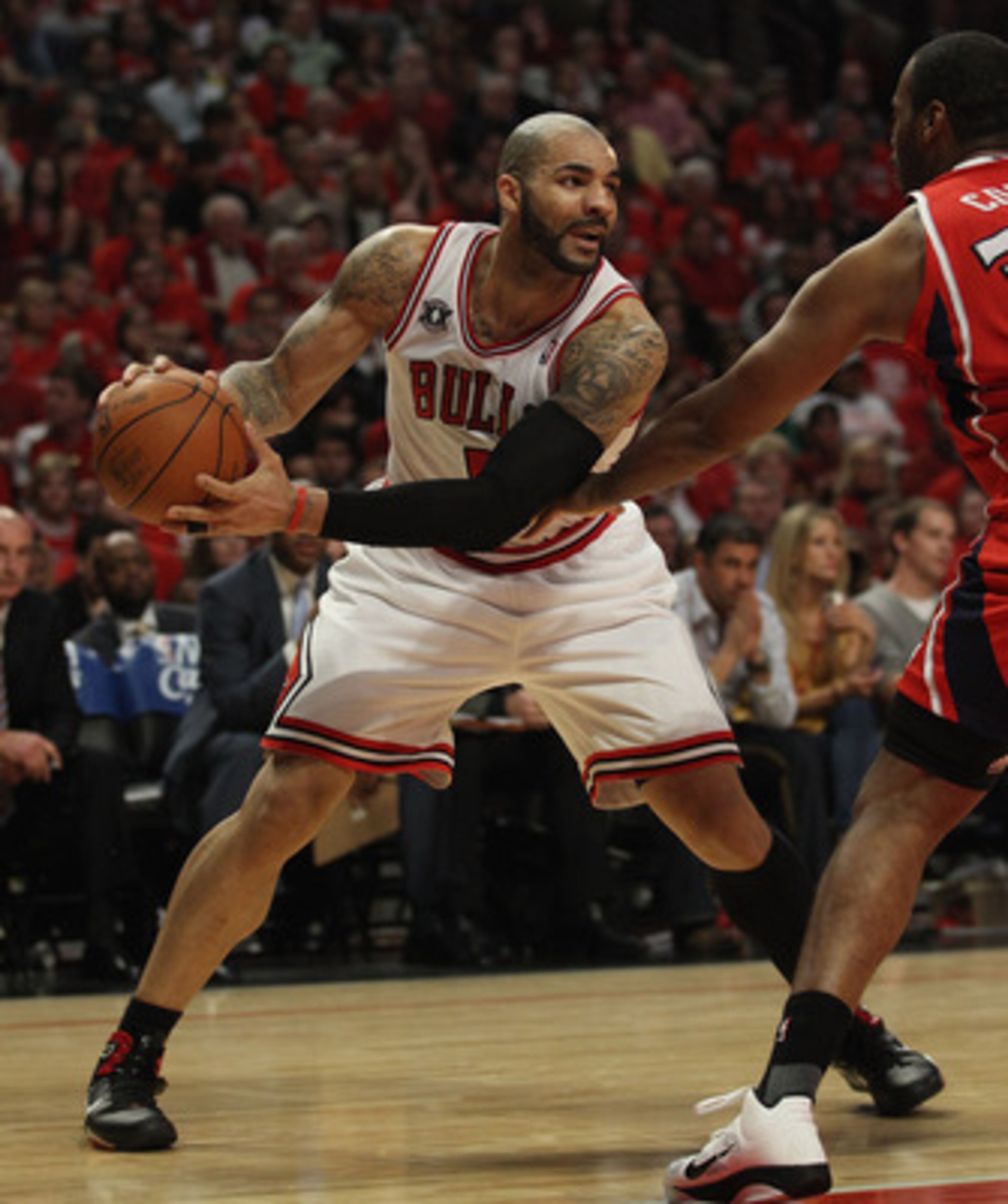 CHICAGO, IL - MAY 10: Carlos Boozer #5 of the Chicago Bulls looks to pass against the Atlanta Hawks in Game Five of the Eastern Conference Semifinals in the 2011 NBA Playoffs at the United Center on May 10, 2011 in Chicago, Illinois. The Bulls defeated th