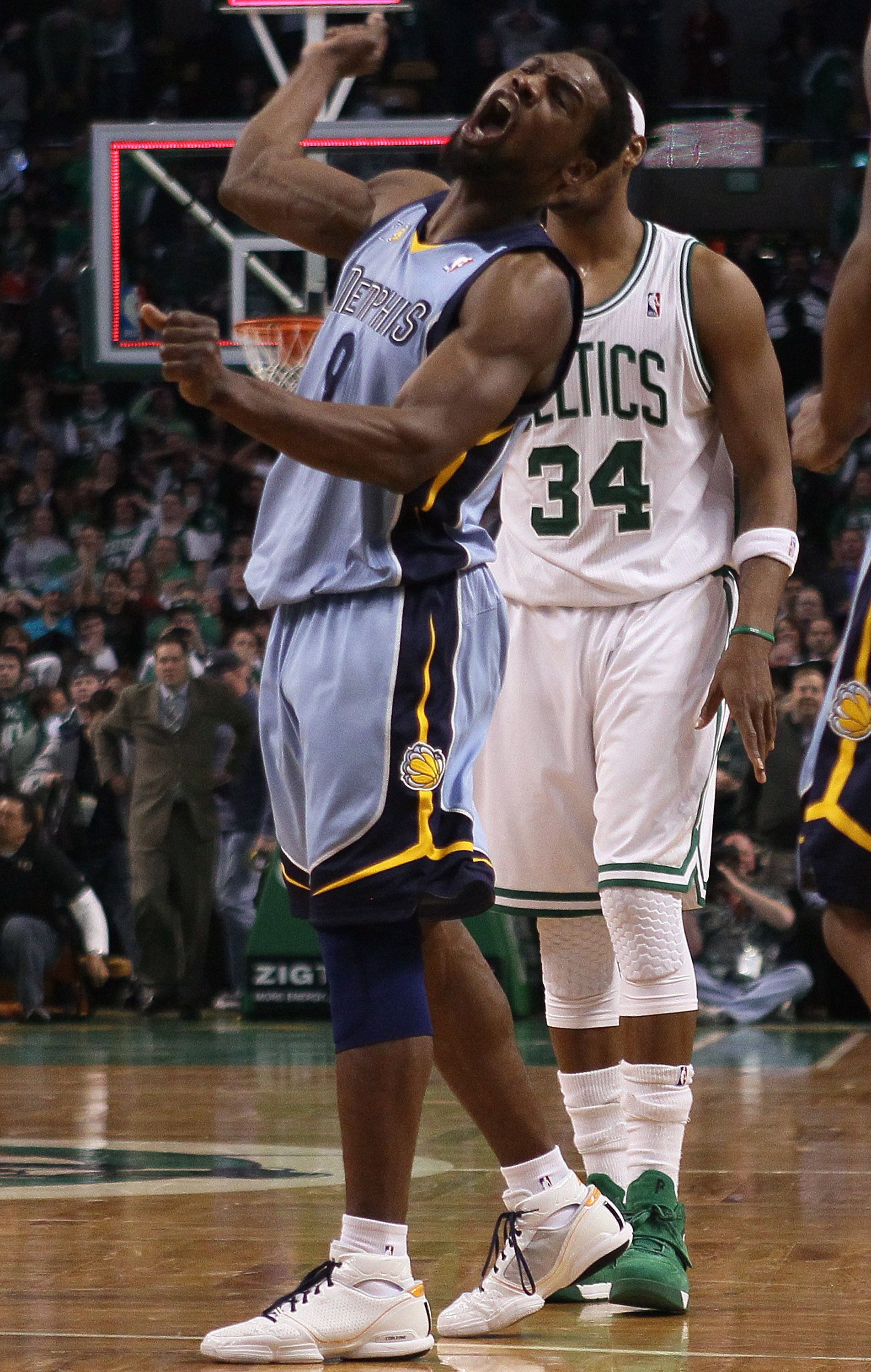 BOSTON, MA - MARCH 23:  Tony Allen #9 of the Memphis Grizzlies celebrates the win as Paul Pierce #34 of the Boston Celtics stands by on March 23, 2011 at the TD Garden in Boston, Massachusetts.  The Memphis Grizzlies defeated the Boston Celtics 90-87. NOT